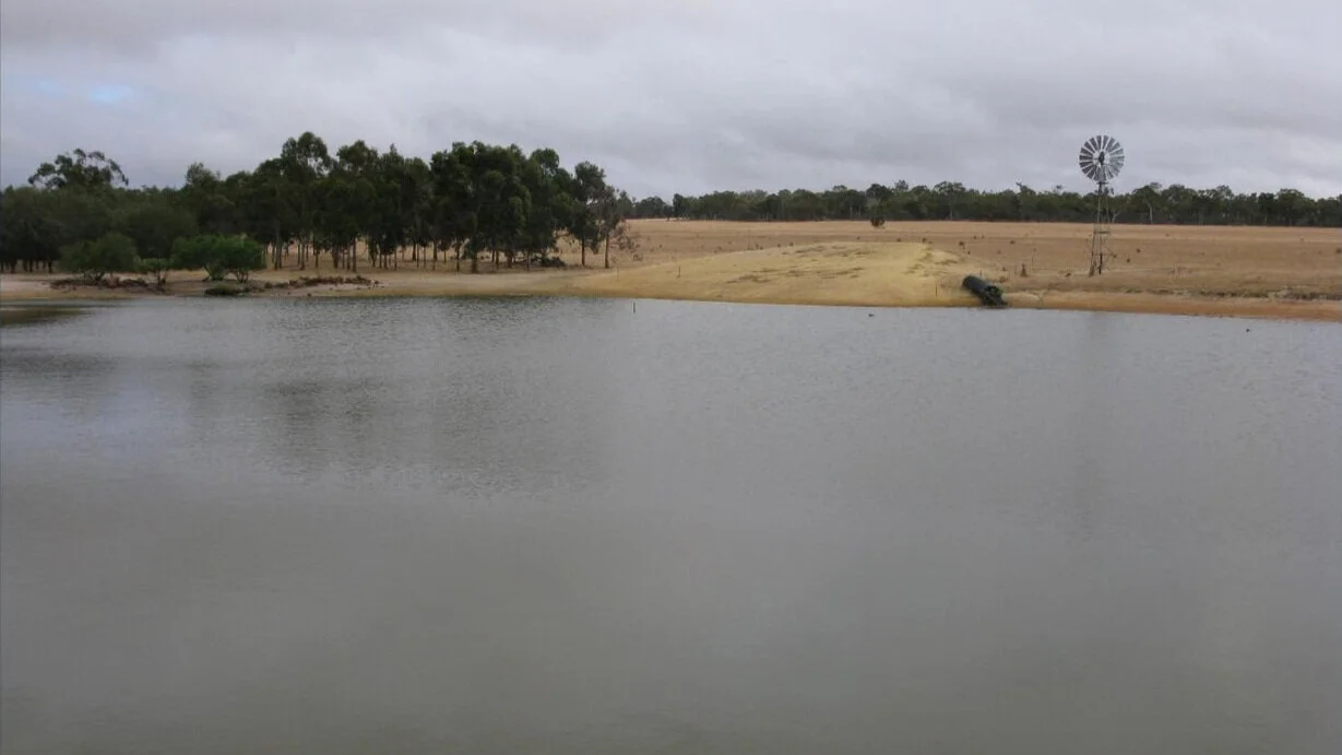 Water storage dam on an Orion property