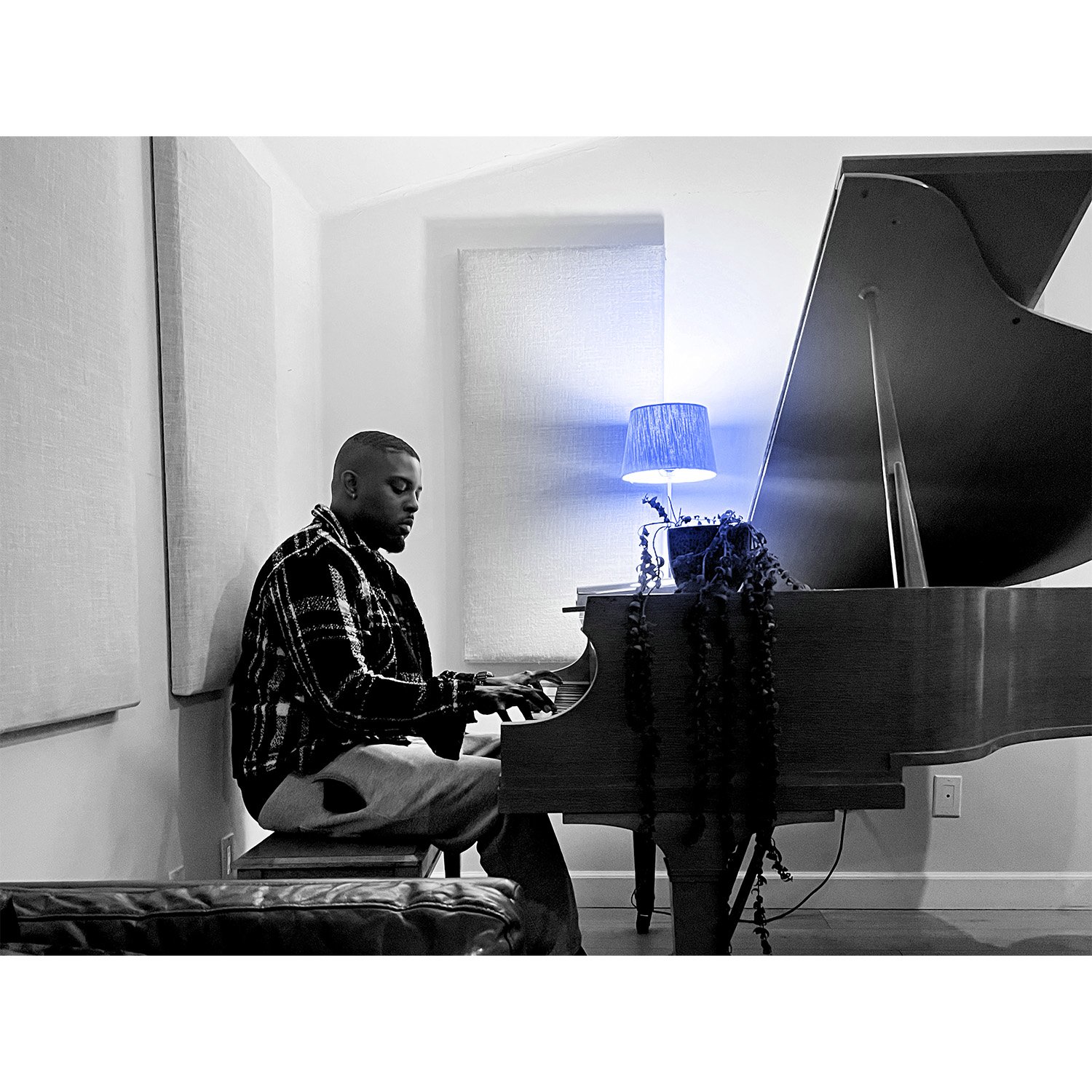 Yestrdy playing piano during a creative session, highlighting the Compton artist, songwriter and producer behind Baby Shay.