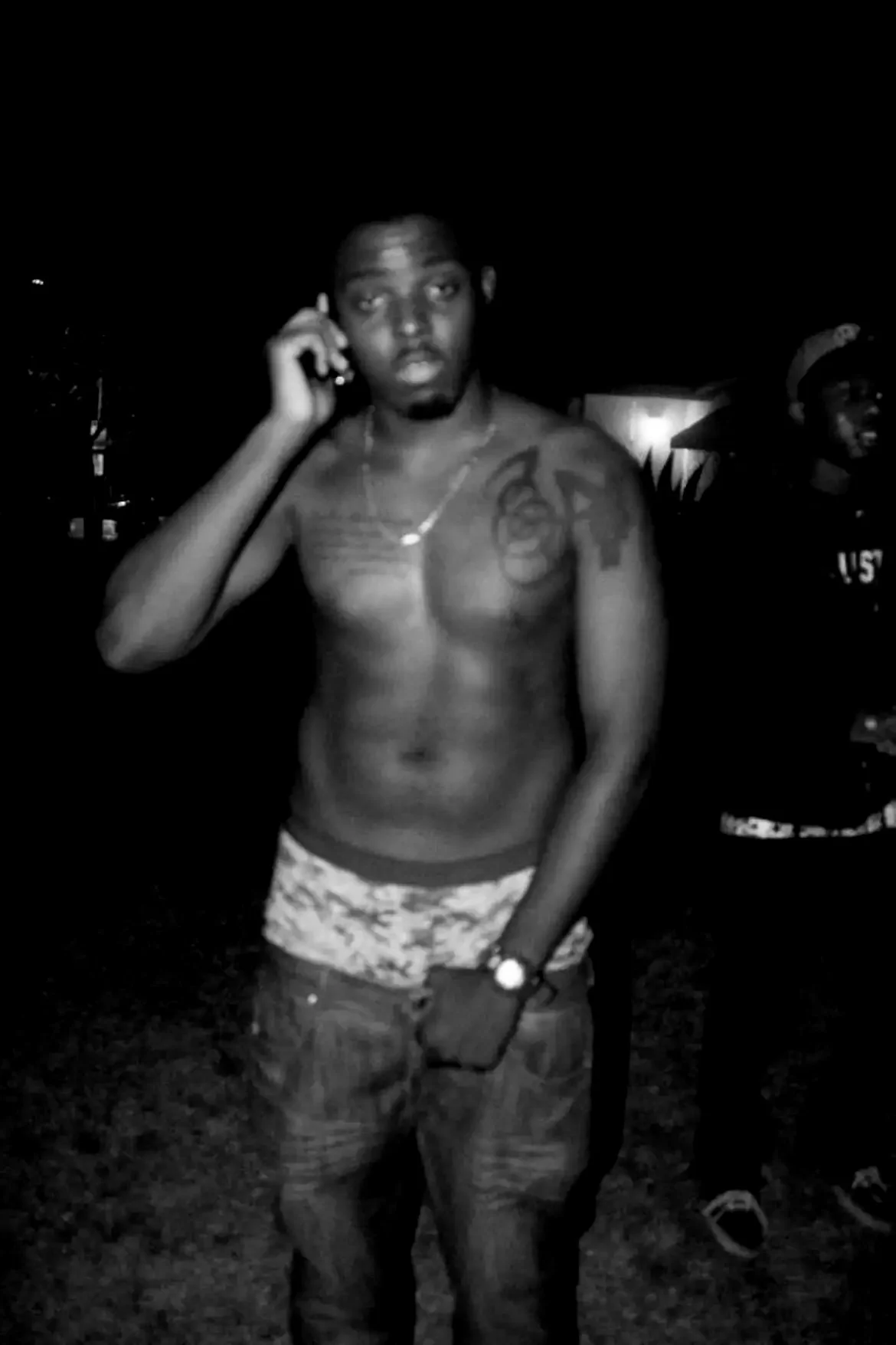 Yestrdy photographed outdoors at night in a black-and-white portrait, part of the Compton artist’s visual story and music imagery.