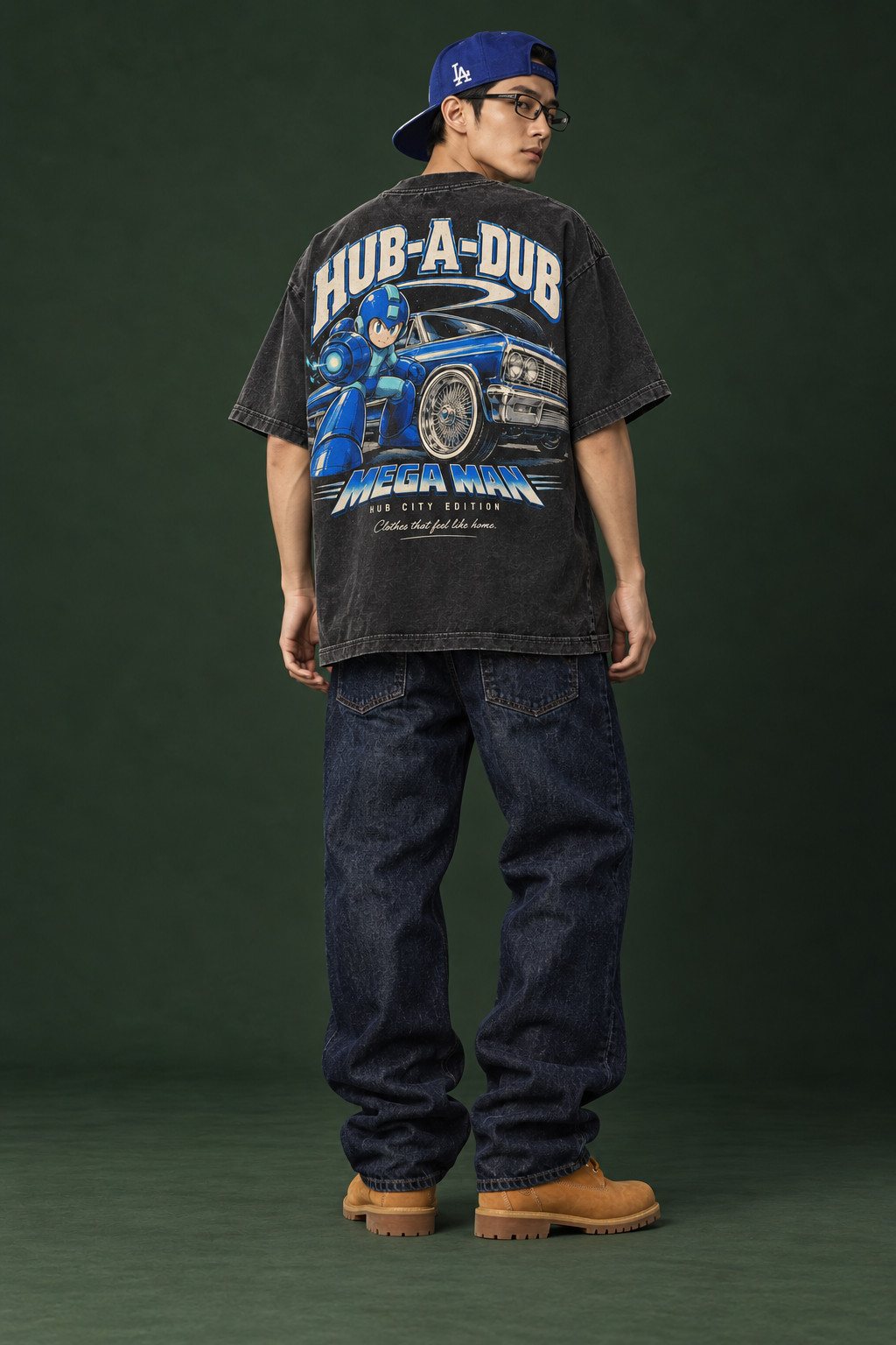 Model wearing the Charged Up tee with blue Mega Man and lowrider back graphic