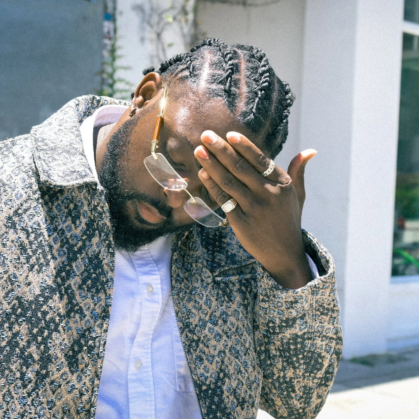 Tourist & Company streetwear campaign featuring a man in a patterned blazer and white shirt photographed outdoors in Los Angeles.