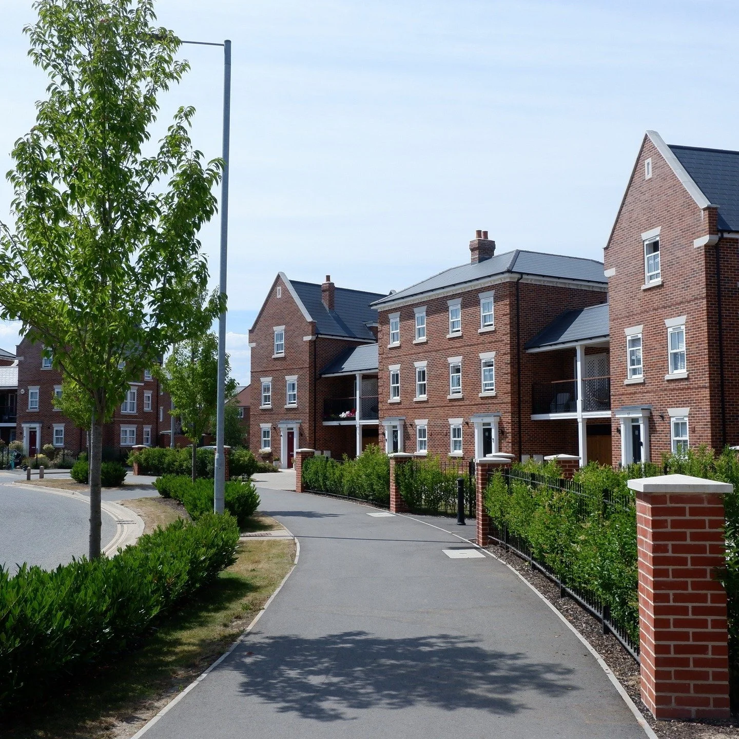 A structured streetscape defined by rhythm, greenery, and active frontages &mdash; the primary route through this new neighbourhood begins to shape its identity.

#urbandesign #townplanning #architecture #streetphotography #streets #colchester #colch