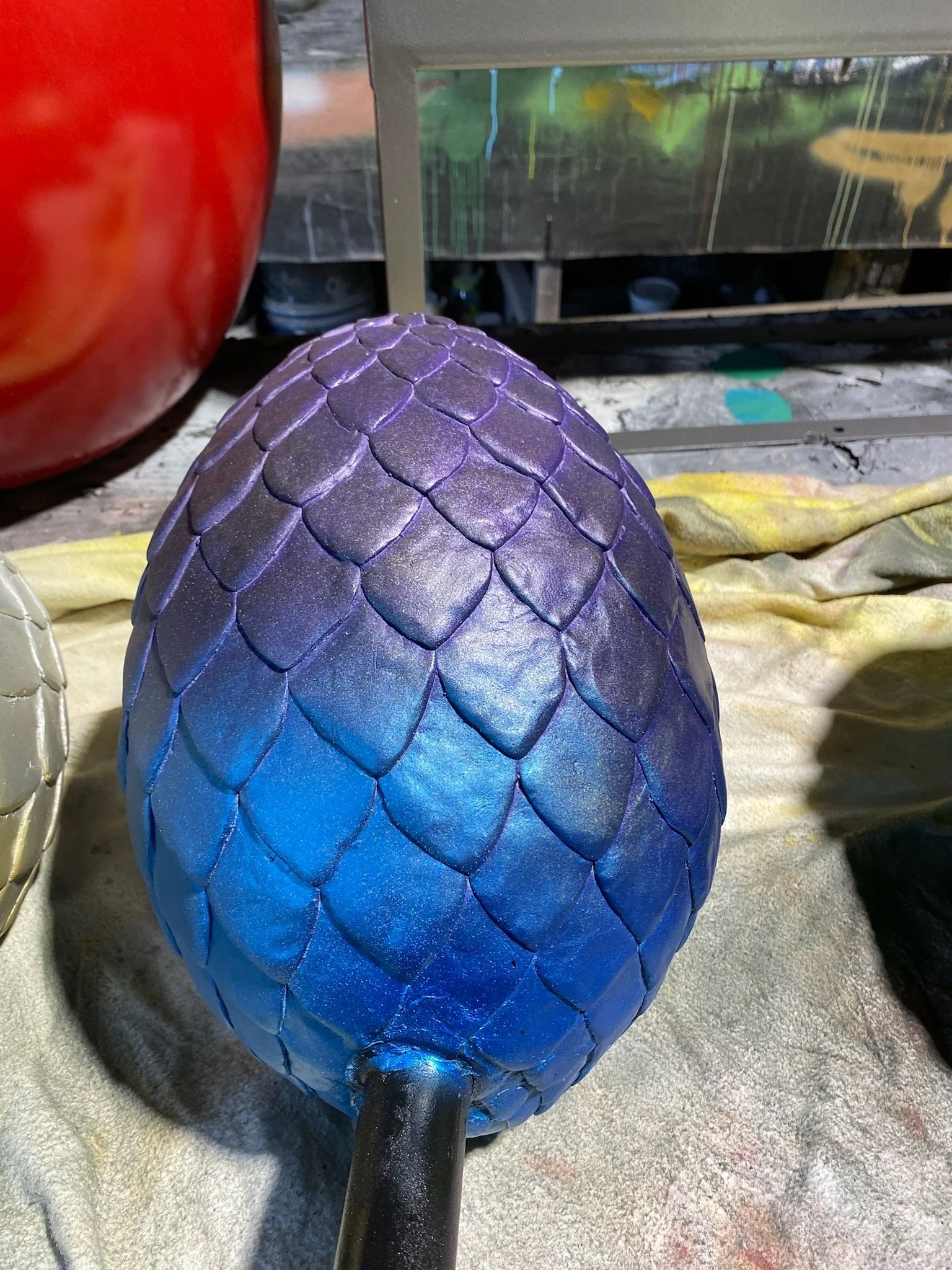 Blue dino egg painted by Matt Smidt at Natureworks Australia