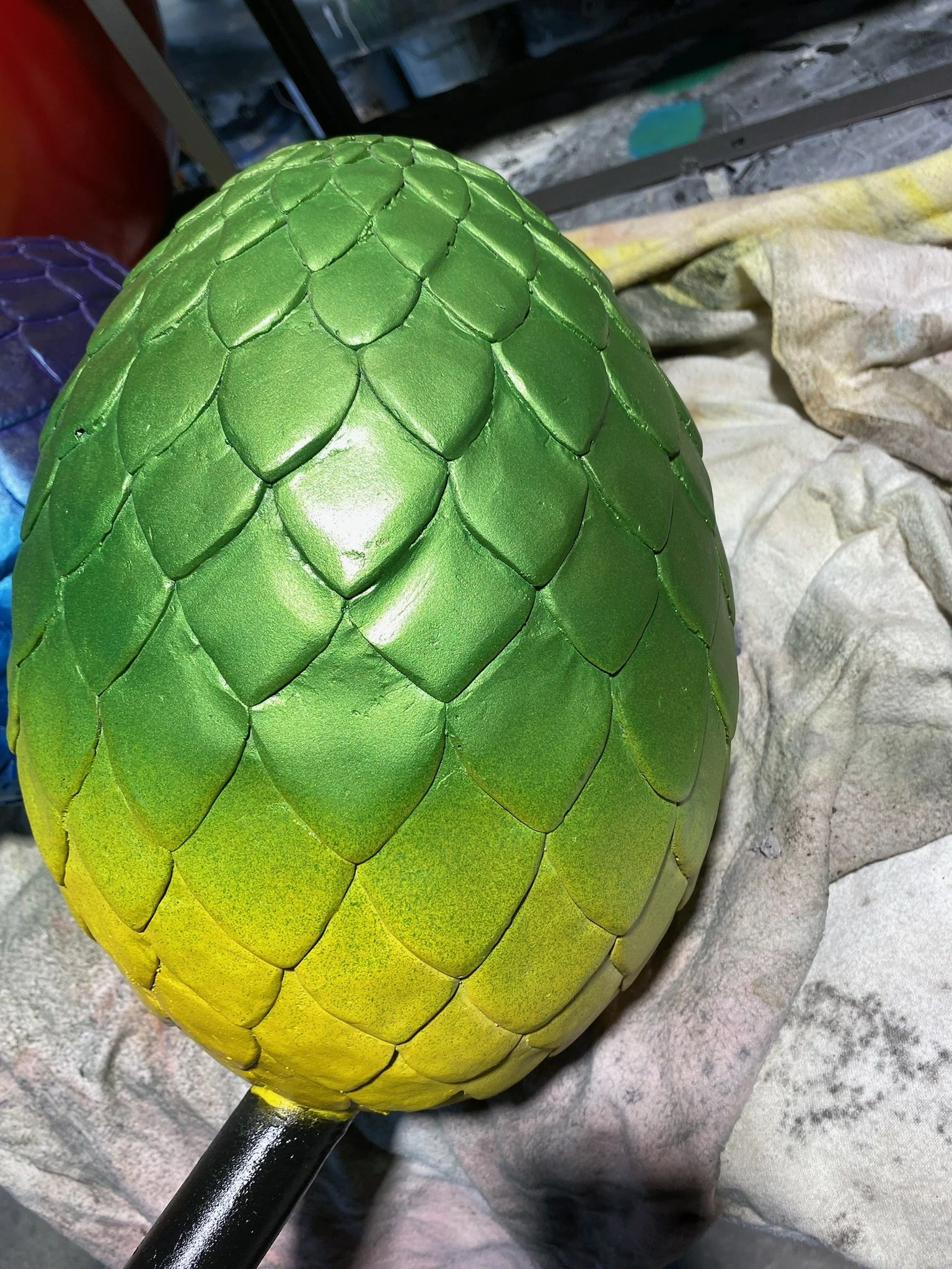 Green dino egg painted by Matt Smidt at Natureworks Australia