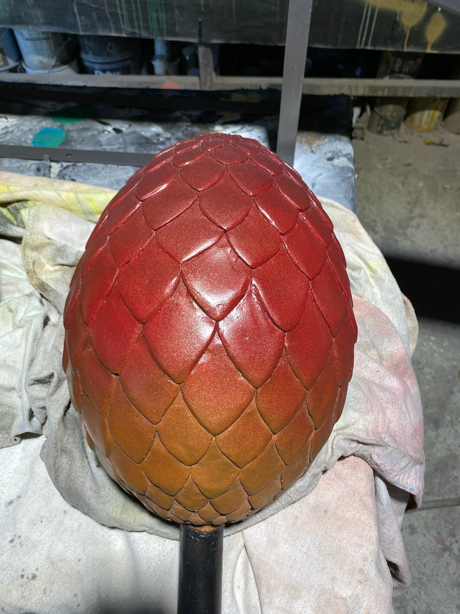 Red dino egg painted by Matt Smidt at Natureworks Australia