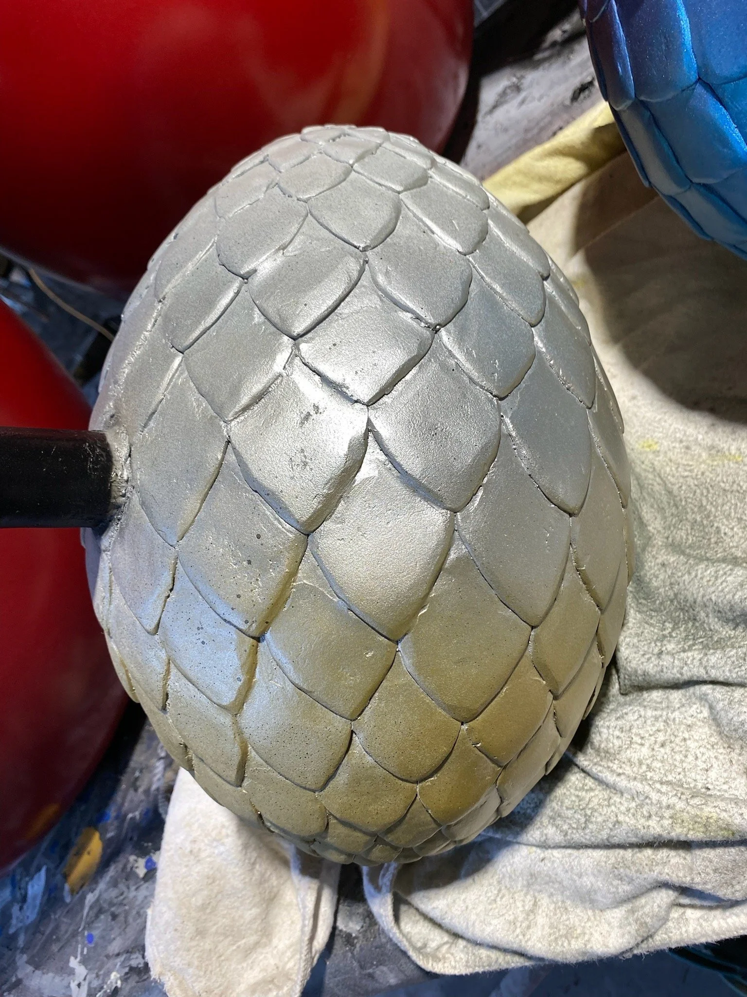 Silver dino egg painted by Matt Smidt at Natureworks Australia