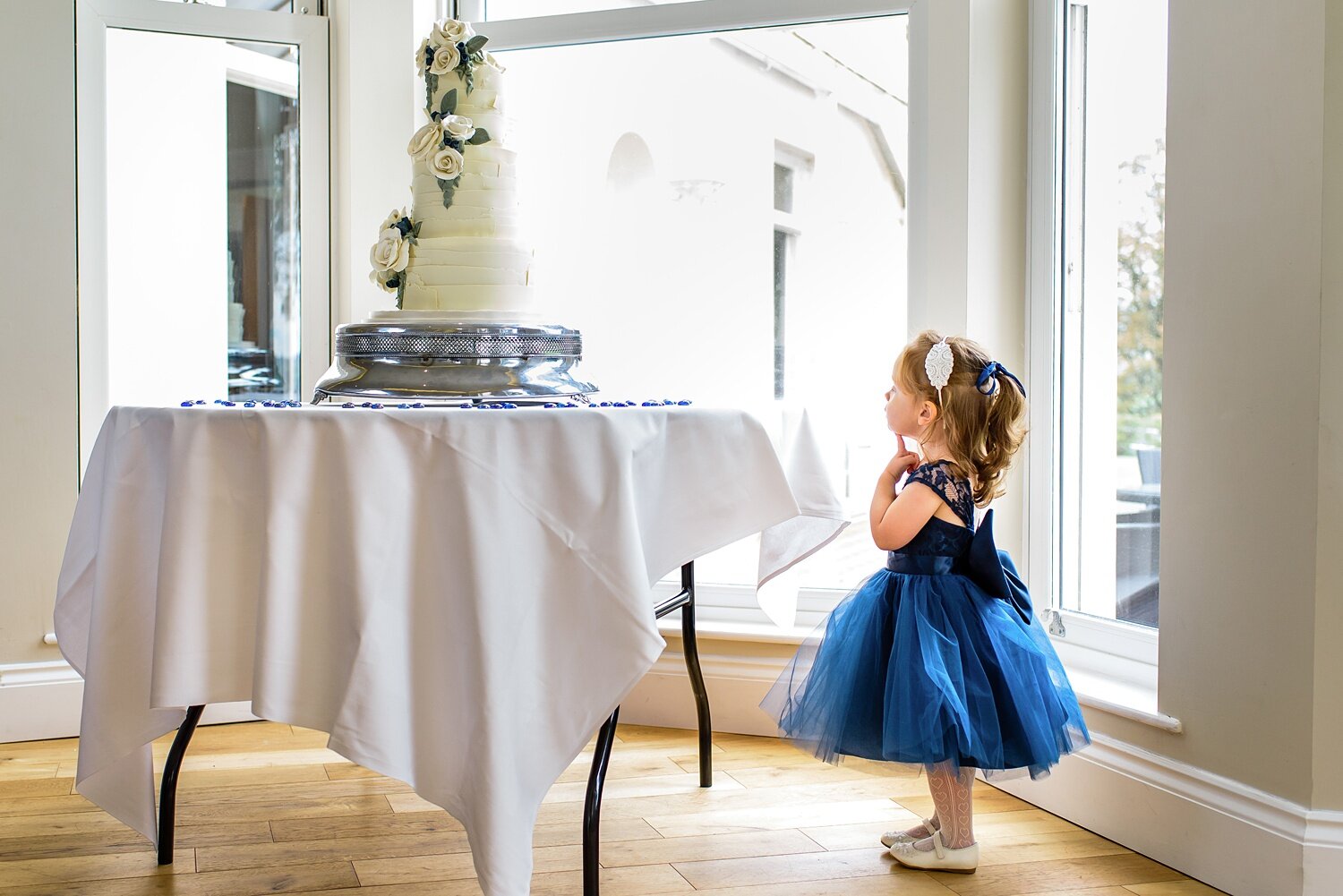 Flower girl and wedding cake