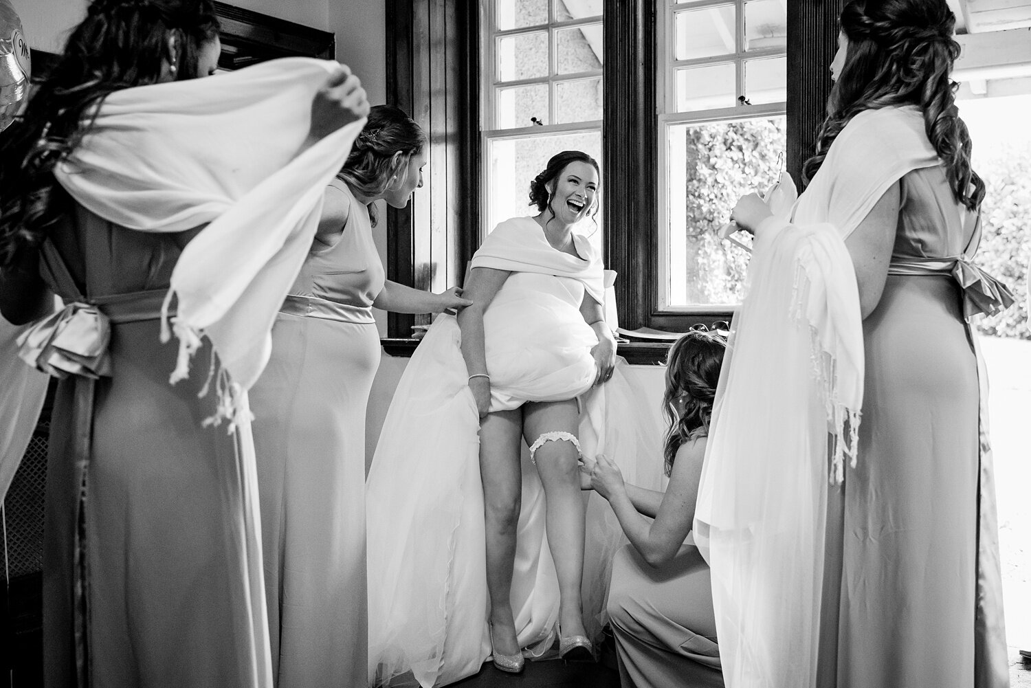 Bride puts on wedding garter