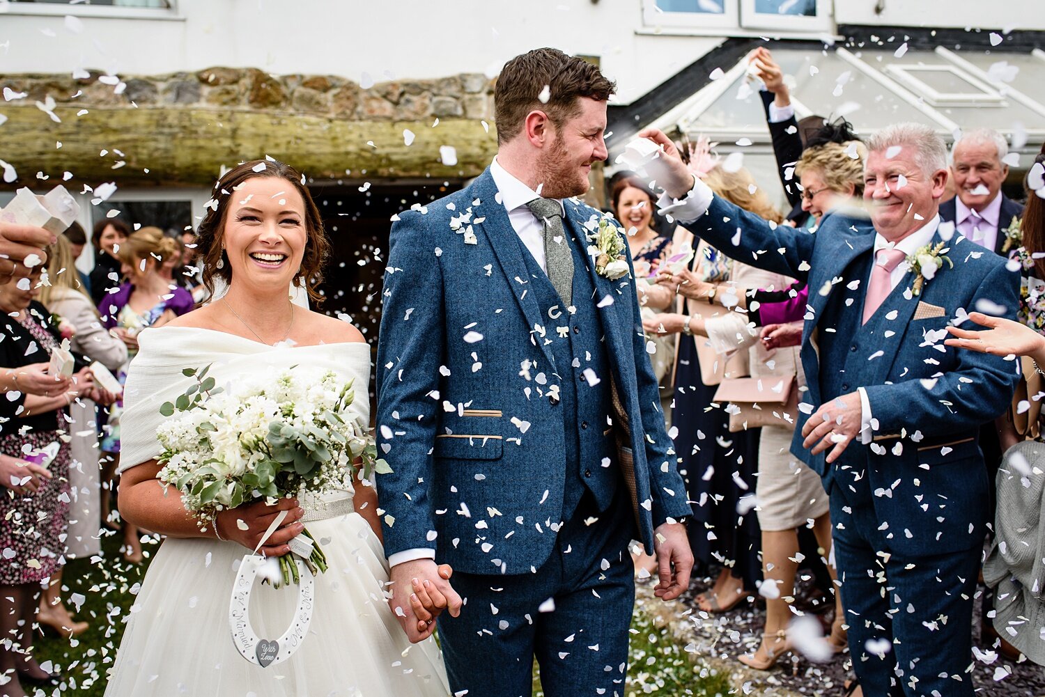 Guests throw confetti at Oxwich Bay Hotel