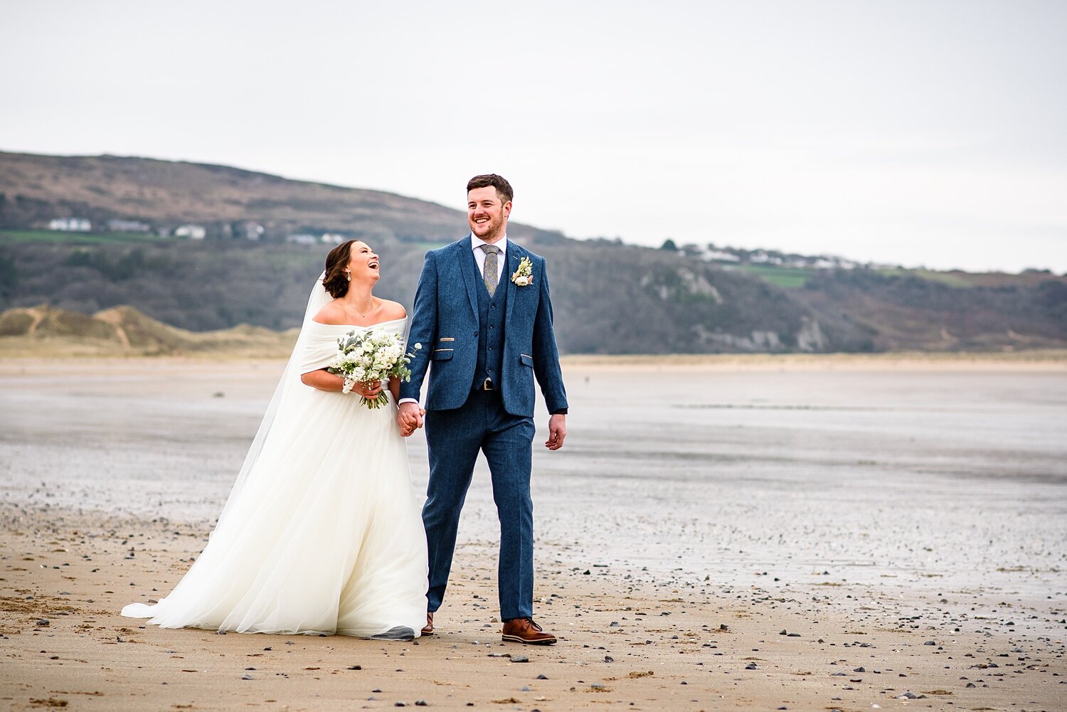 Bride and groom at Oxwich Bay beach