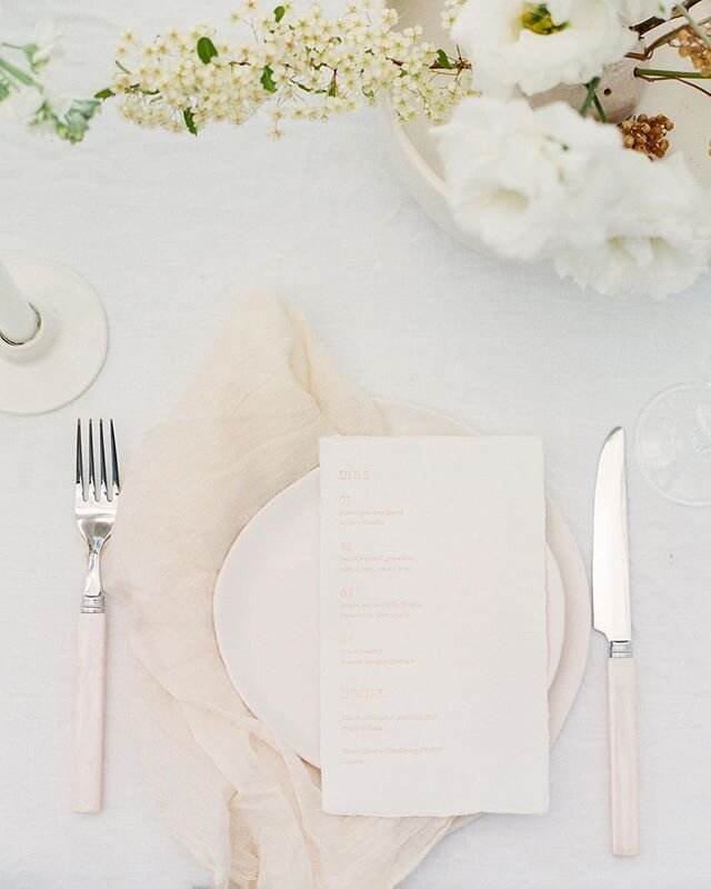 If you are leaning towards neutral colour palette for your wedding you could enhance the overall design with adding layers of texture and interesting details, like hand made paper with gold foil lettering, soft linens, crystal cut glasses and dry flo