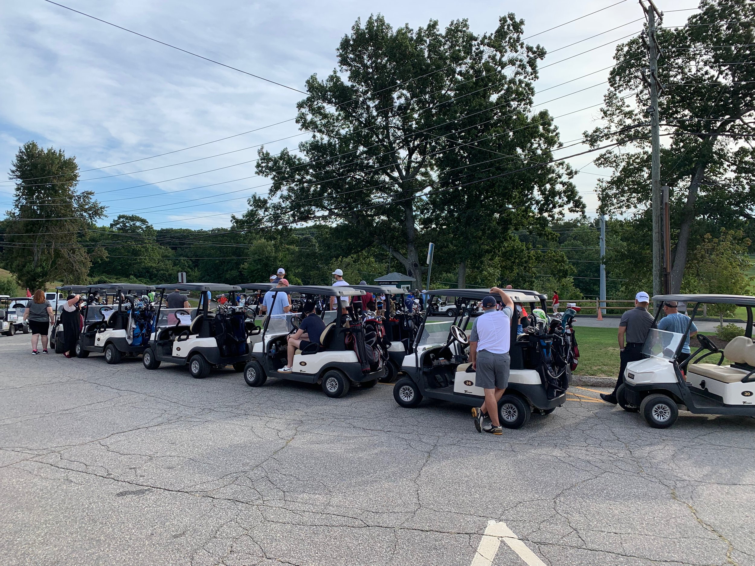 Golfers in Carts lined up.jpeg