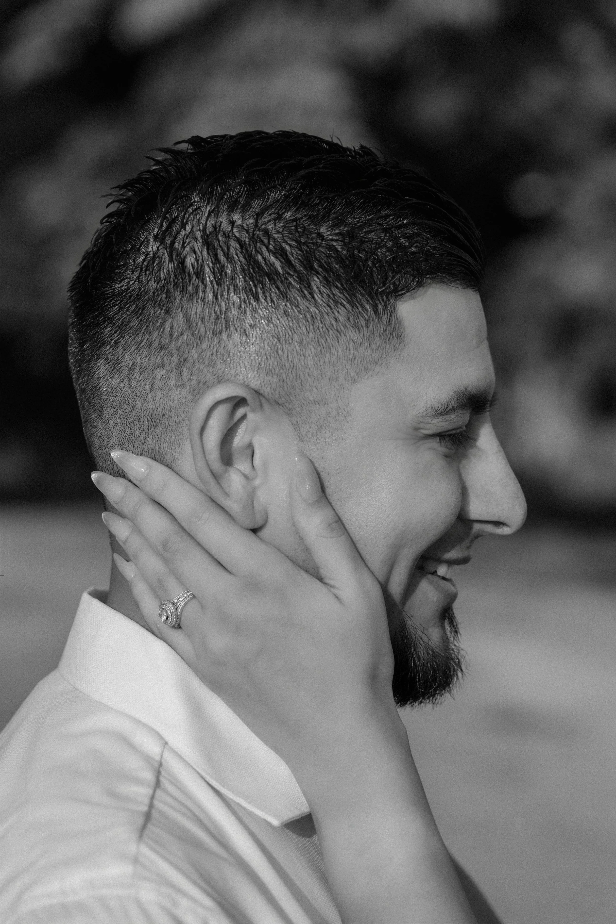 A bride's hand caressing the groom shot by a luxury wedding photographer during an intimate elopement in Old San Juan, Puerto Rico