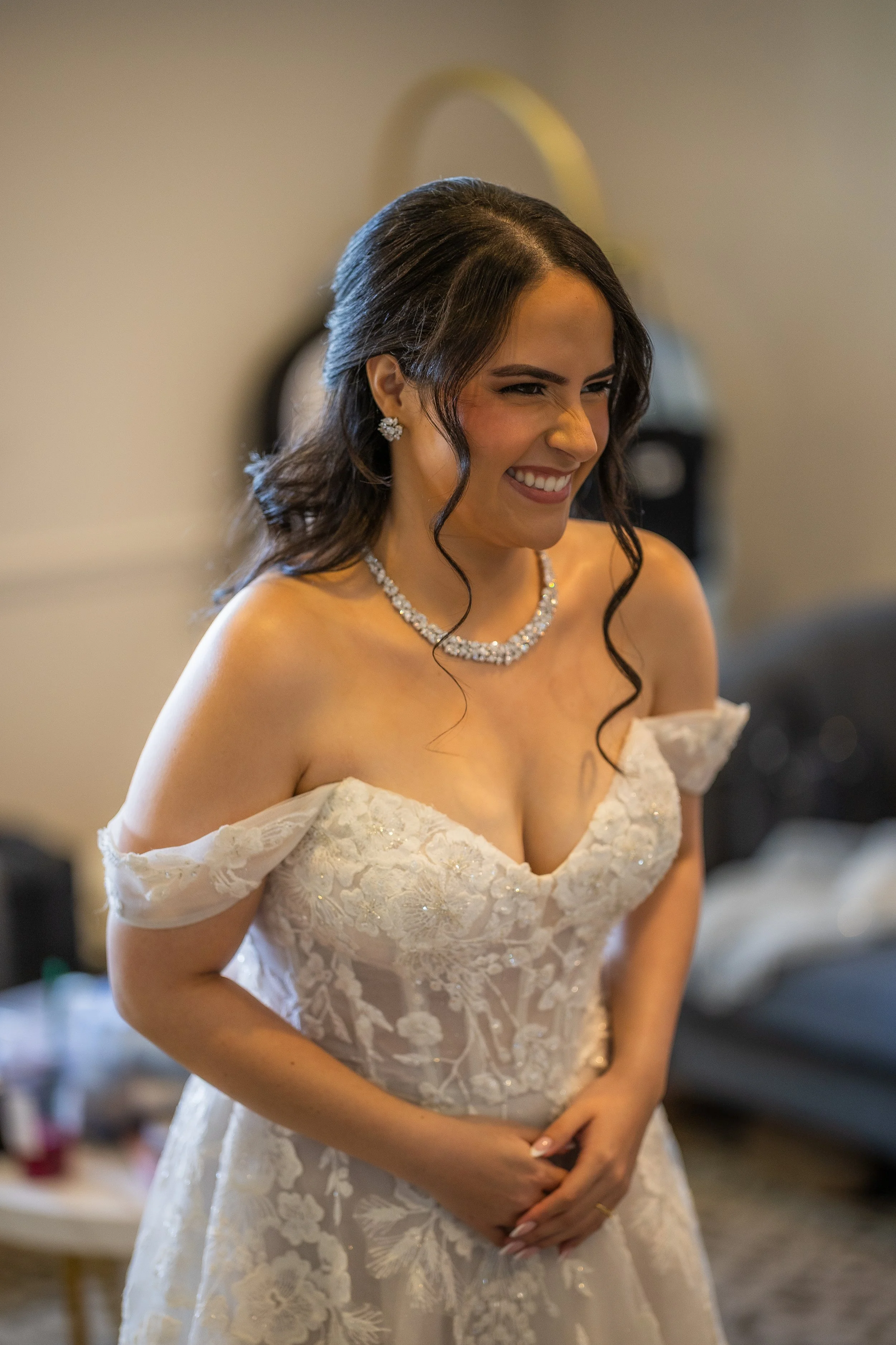 Bride revealing her wedding dress to her bridesmaids at Indian Spring Country Club in Boynton Beach, Florida