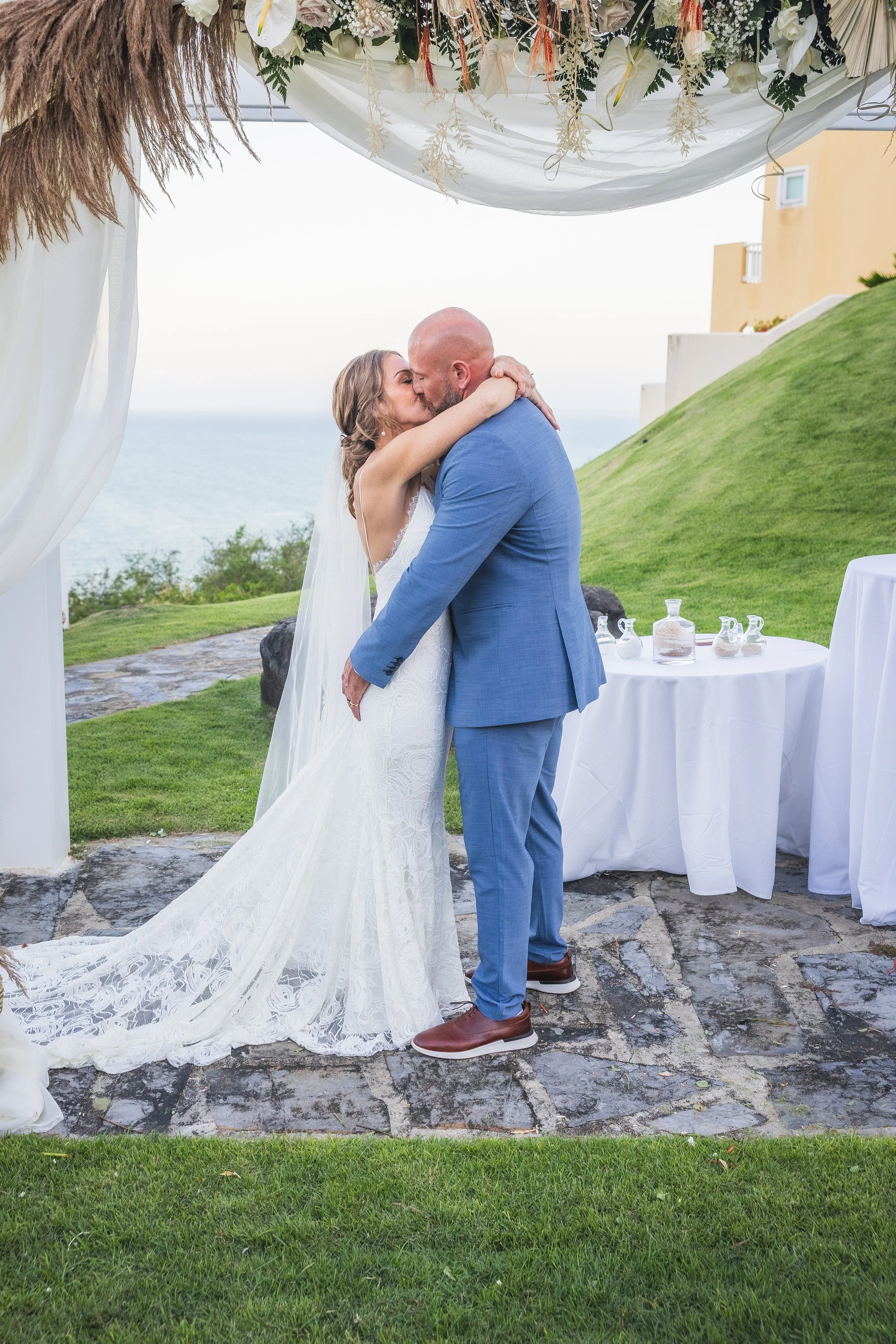 First kiss at El Conquistador Resort during a luxury wedding taken by a Puerto Rico editorial photographer