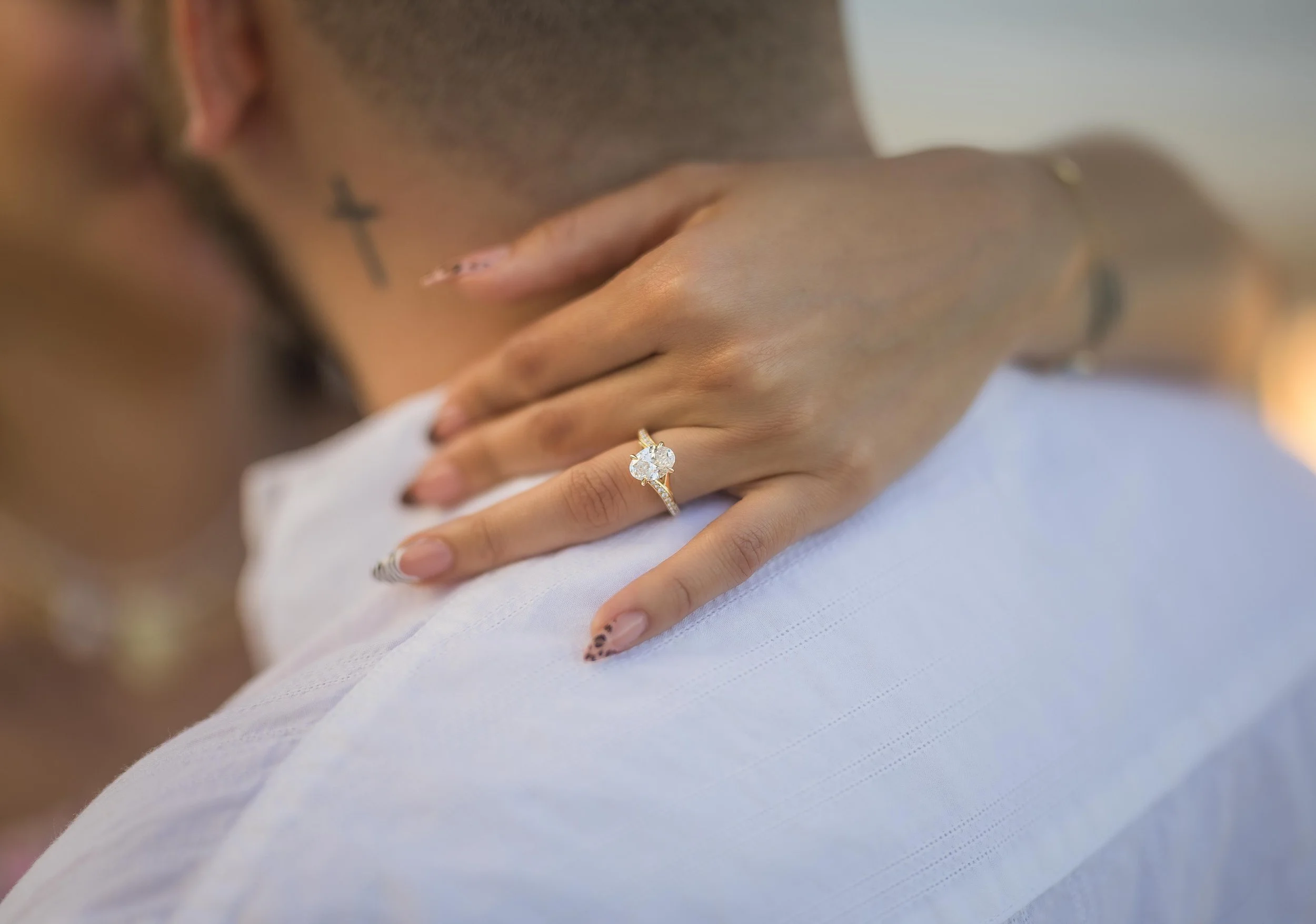 Engagement photos taken immediately after proposal highlighting genuine emotion and professional couple photography.