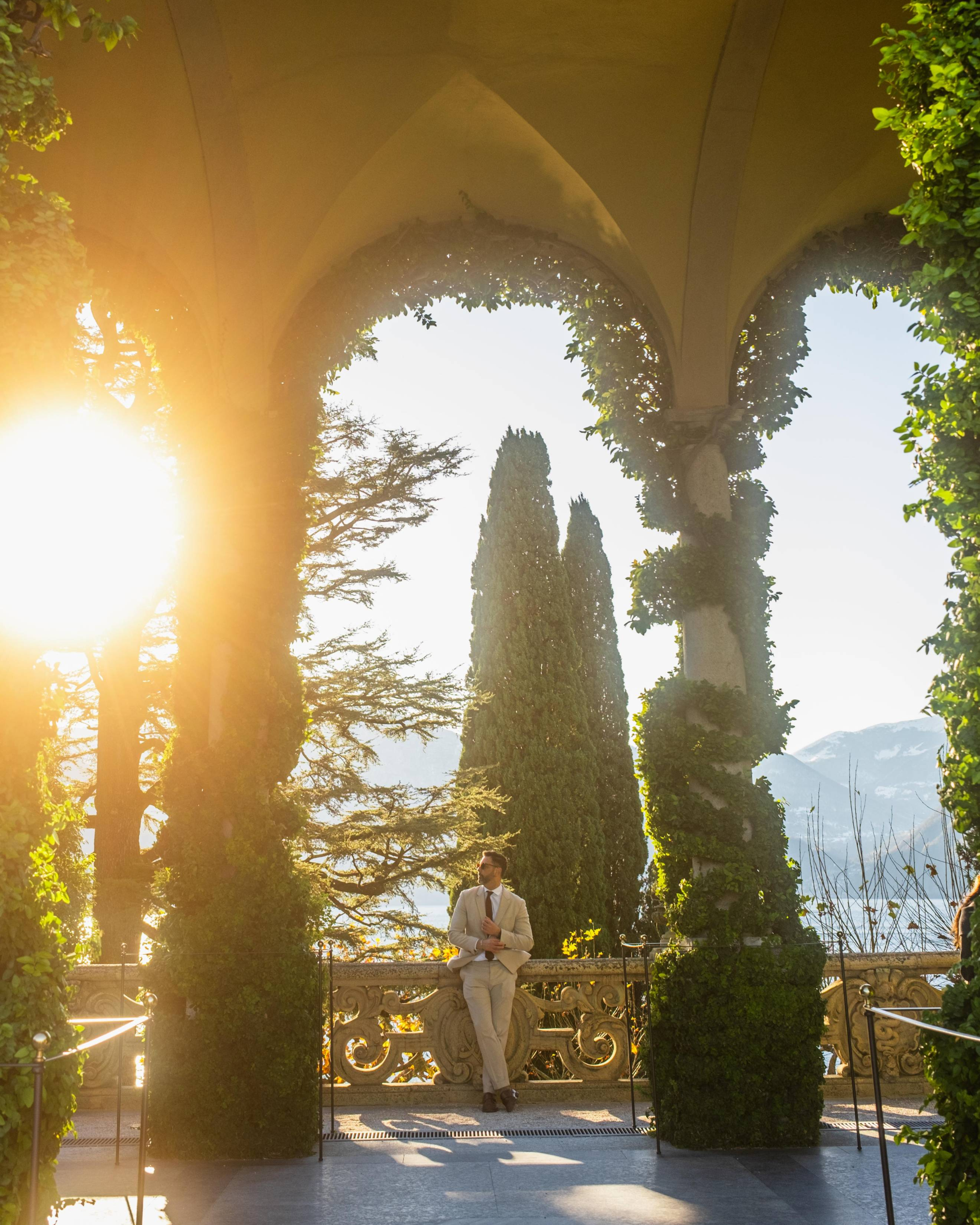 Luxury architecture and ivy-covered arches at Villa del Balbianello in Lake Como, Italy.