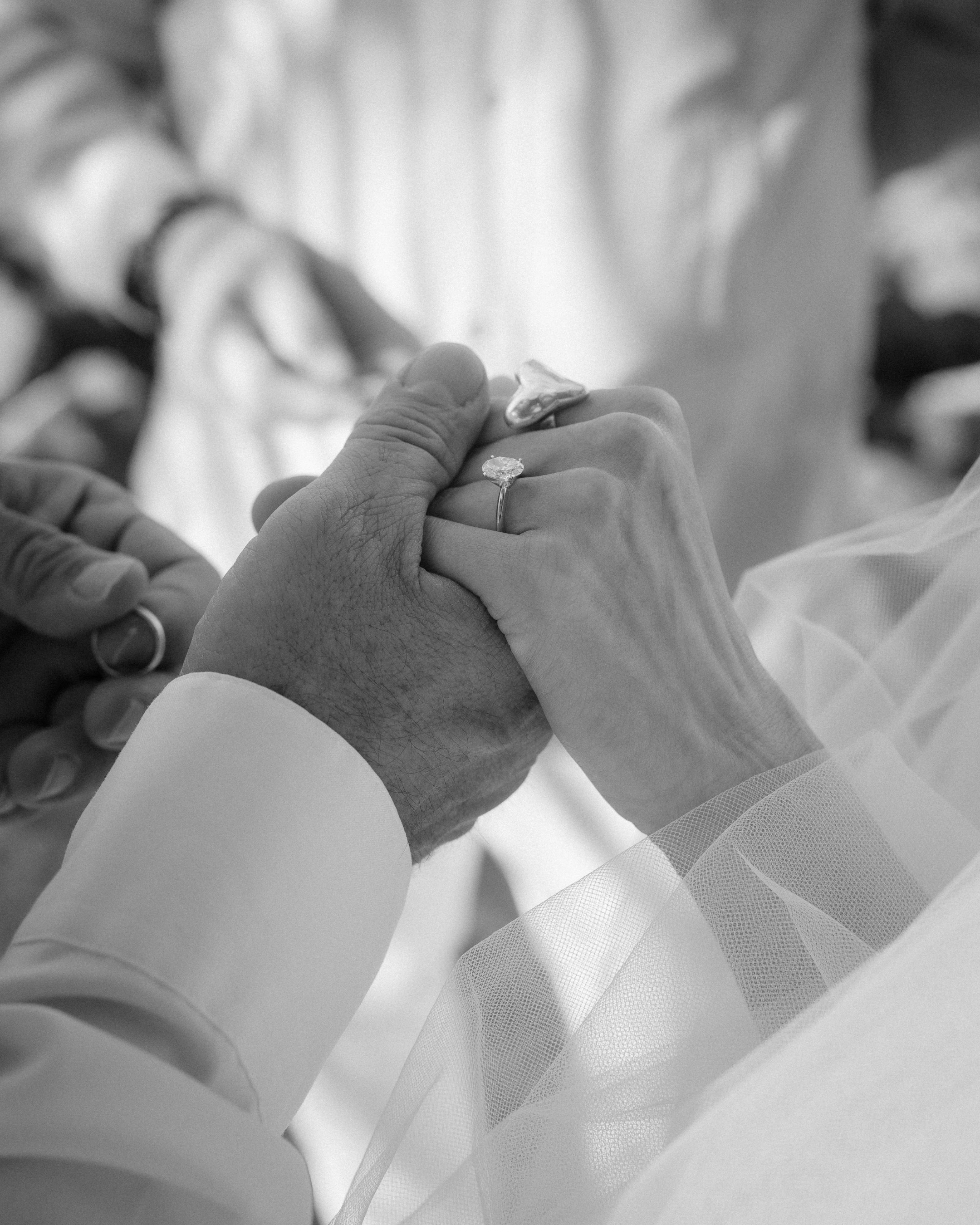 Couple holding hands during a beach elopement in Puerto Rico
