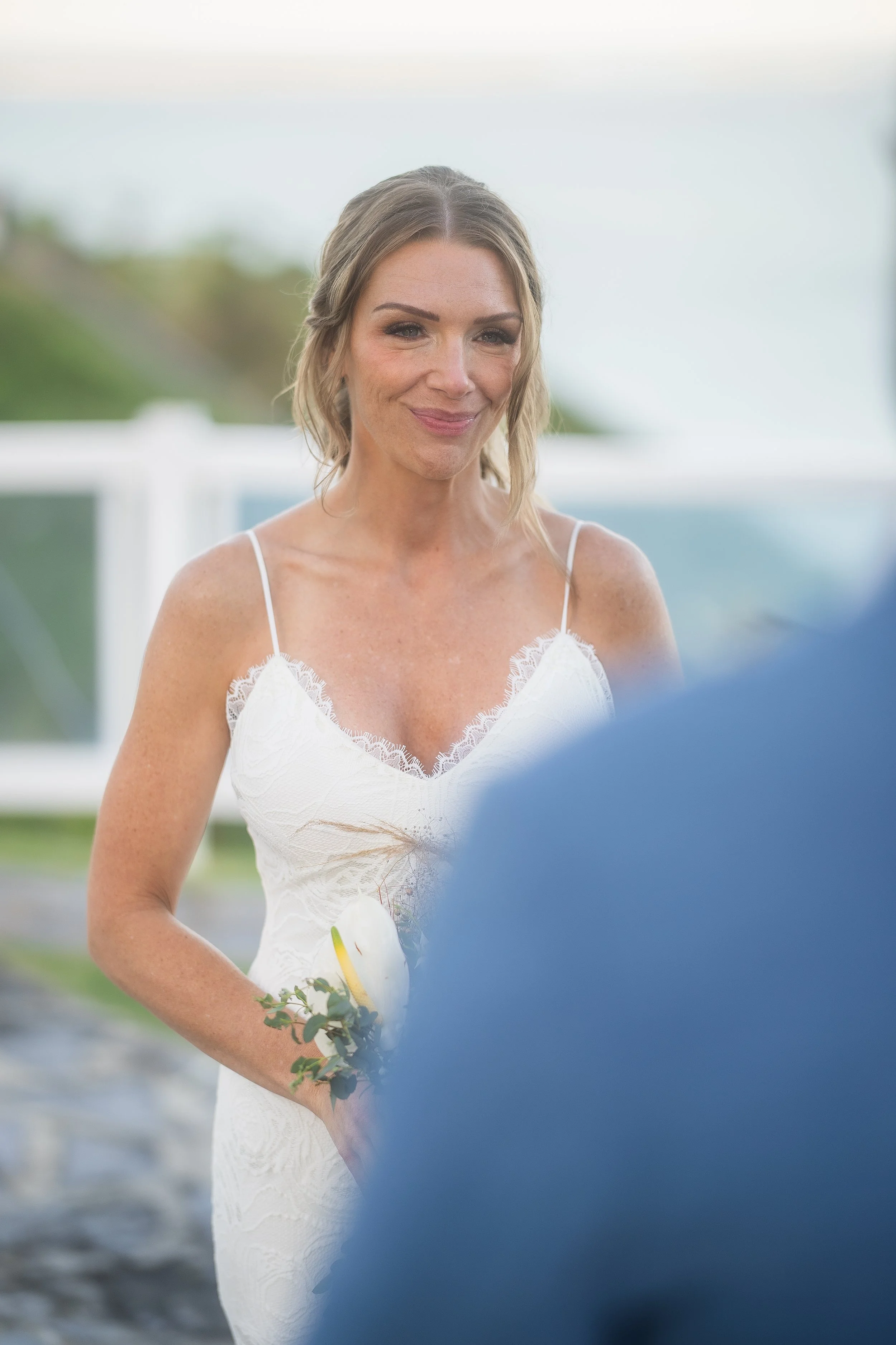 Bride listening to groom during ceremony at El Conquistador Resort taken by a Puerto Rico wedding photographer