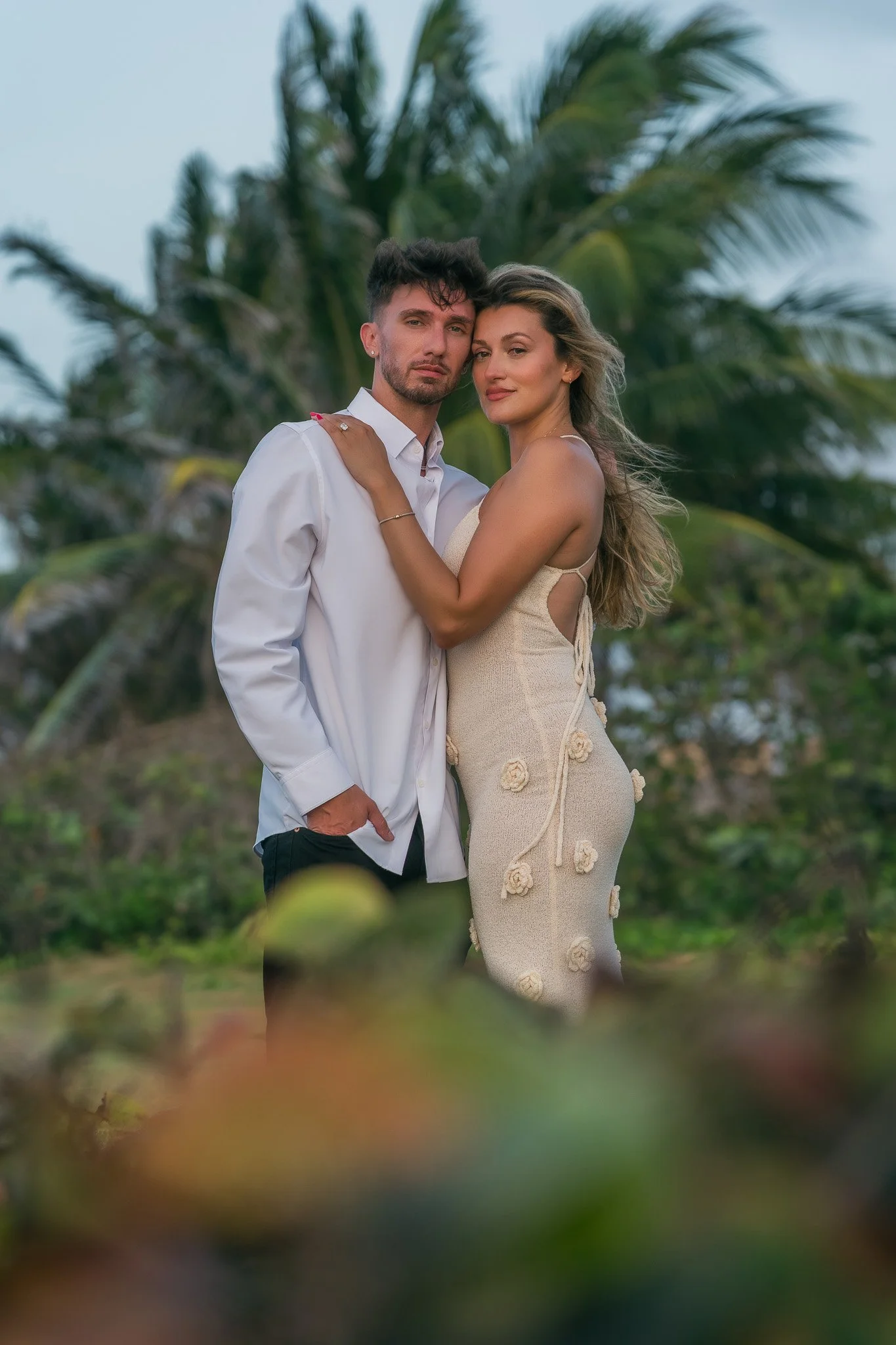 Editorial portrait of a couple at Escambrón Beach during their engagement session in Puerto Rico