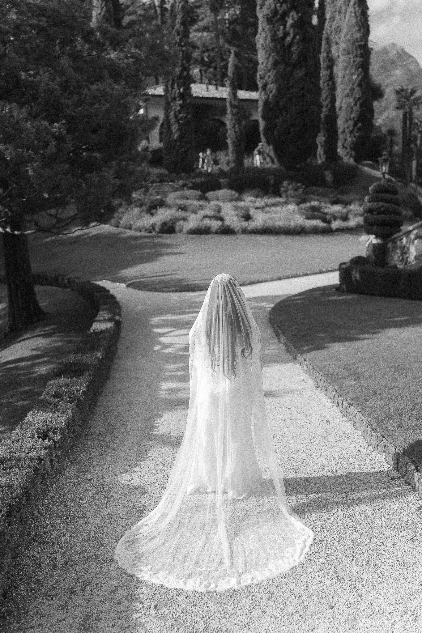 Black and white portrait of a bride during her luxury elopement at Villa del Balbianello in Lake Como taken by a destination wedding photographer in Italy
