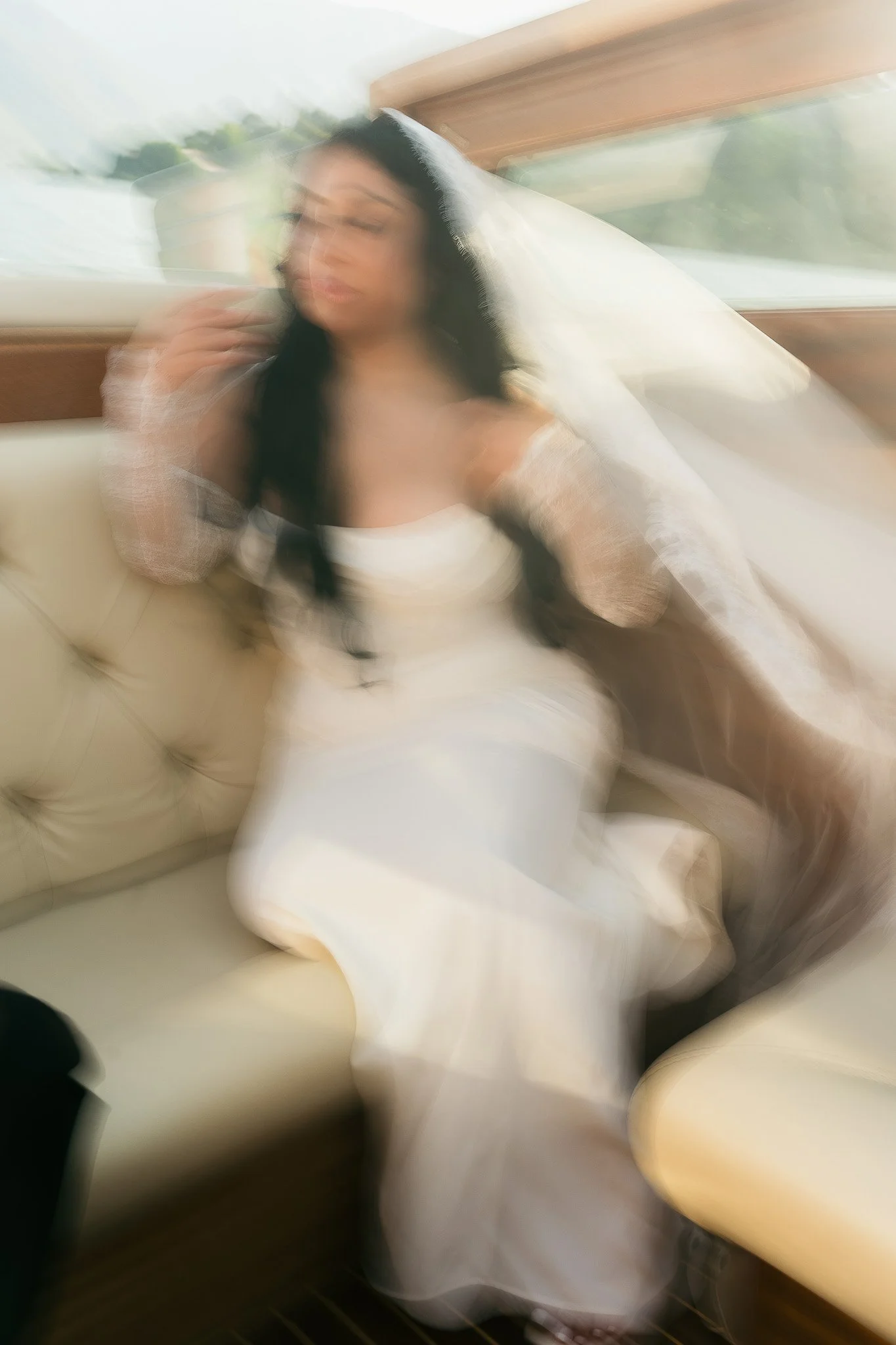 Blurry portrait of a bride in Lake Como, Italy during her elopement at Villa del Balbianello taken by a luxury destination wedding photographer