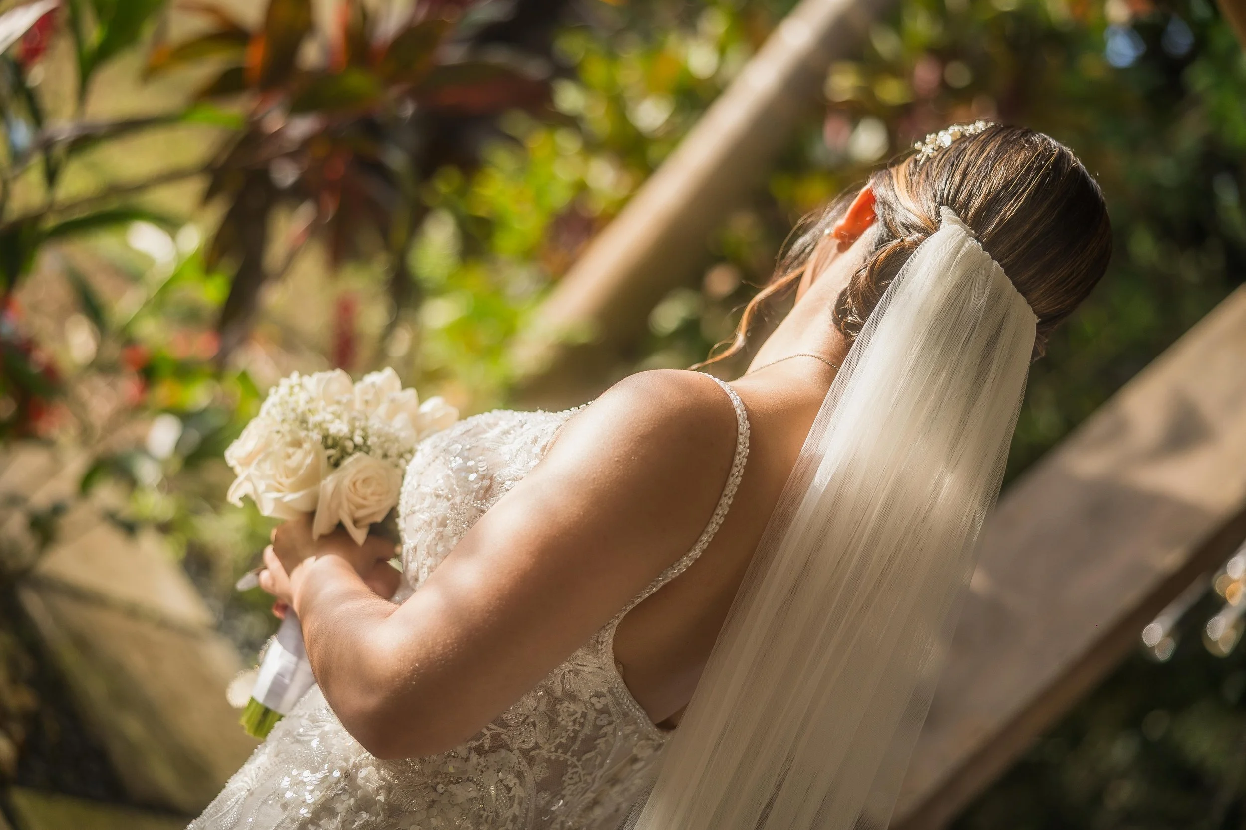 Bride holding bouquet during wedding at Hacienda Santiago in Puerto Rico