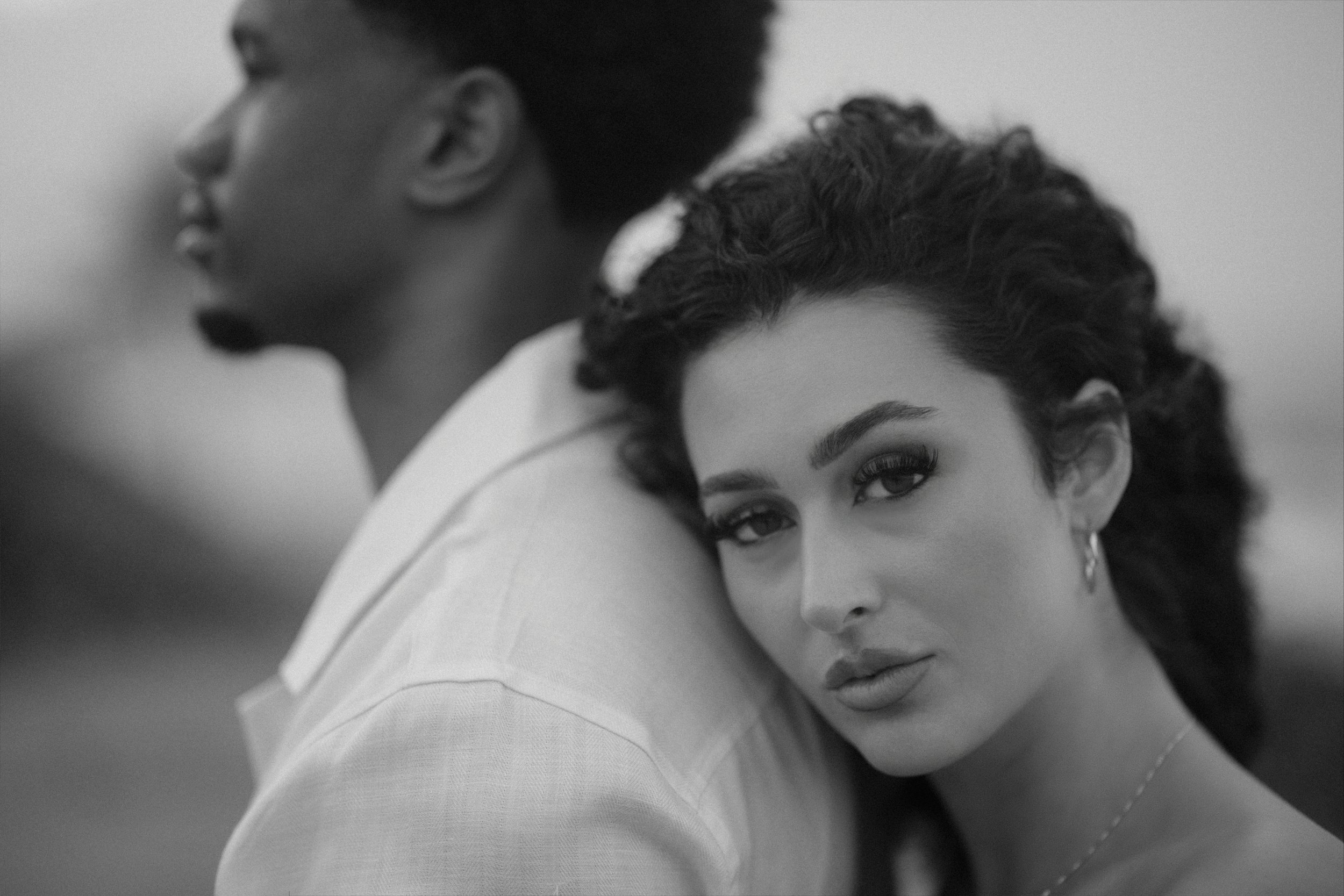 Editoria portrait of a newly engaged couple at Escambron Beach taken by a luxury wedding photographer in Puerto Rico
