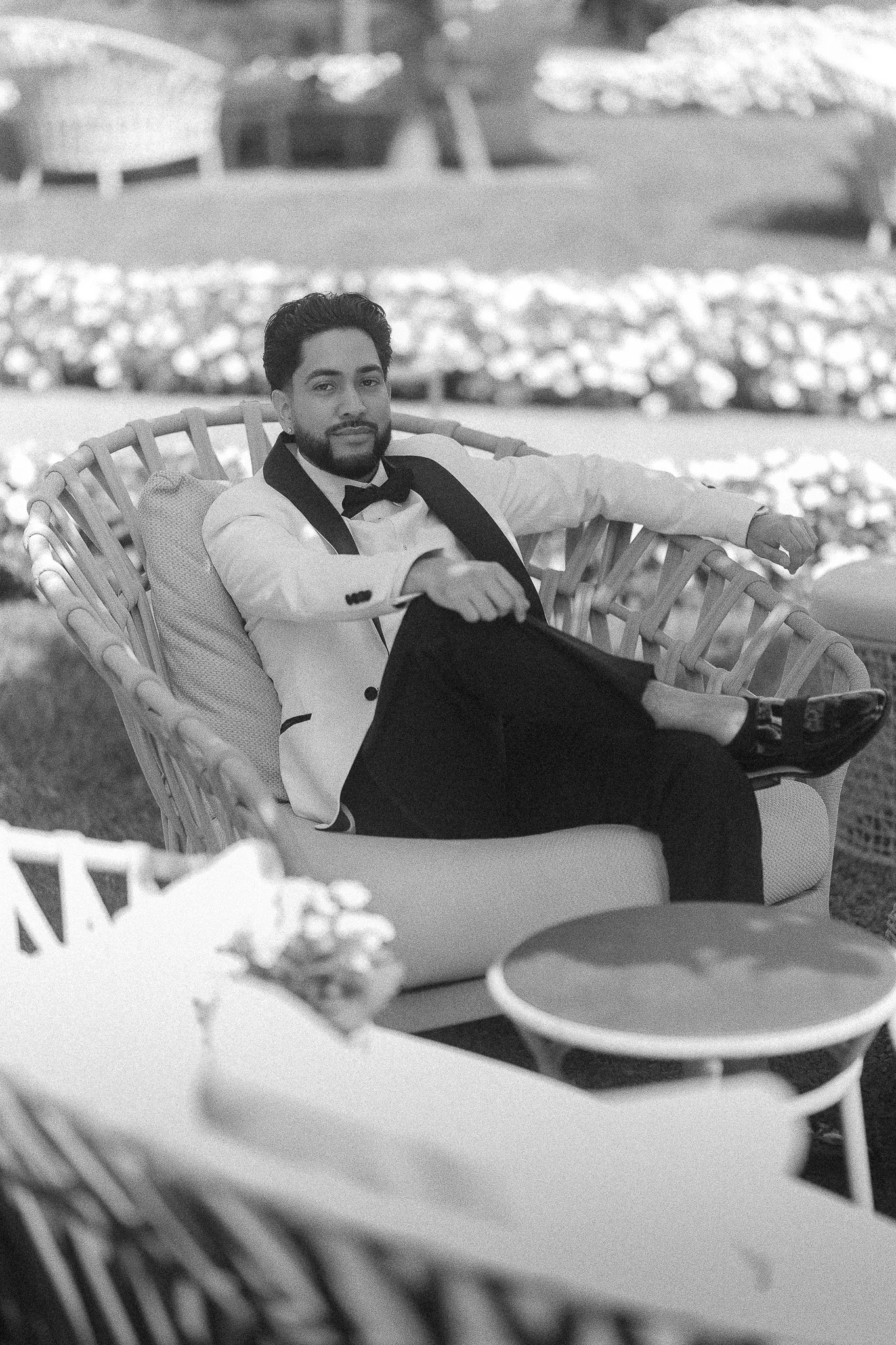 Editorial black and white portrait of a groom at Grand Hotel Victoria in Menaggio, Lake Como, Italy prior to his luxury elopement at Villa del Balbianello taken by a destination wedding photographer