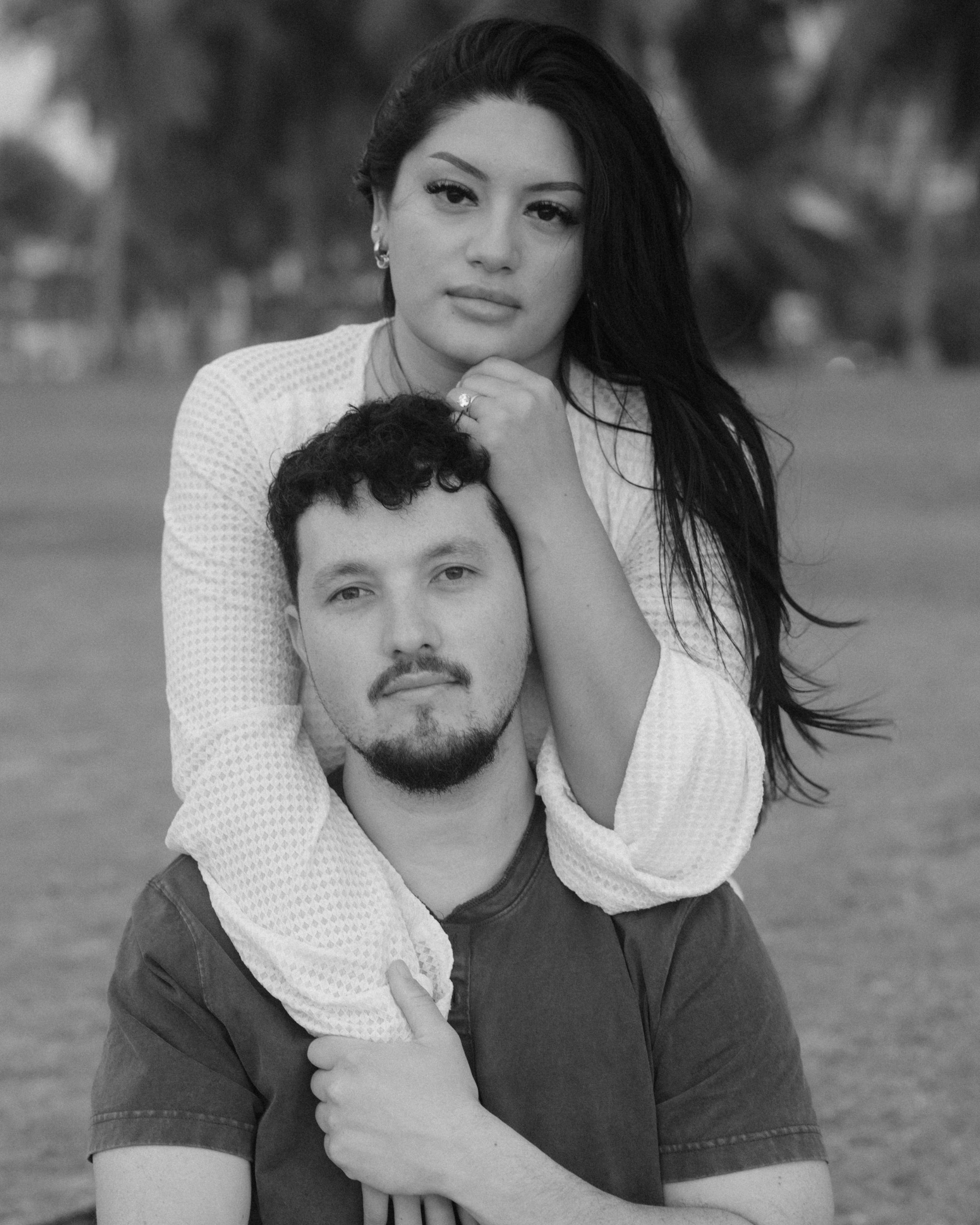 Romantic sunset portraits of engaged couple at Escambrón Beach