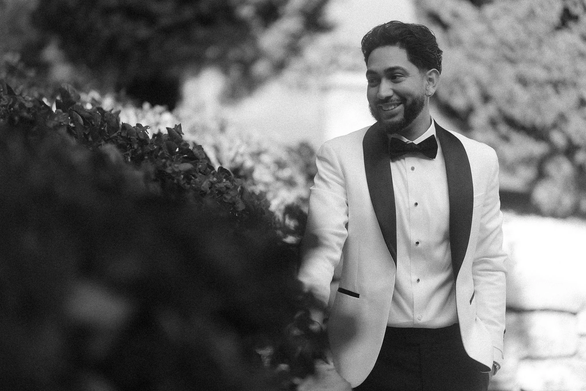 Editorial portrait of a groom during an elopement taken by a destination wedding photographer in Lake Como, Italy at Villa del Balbianello