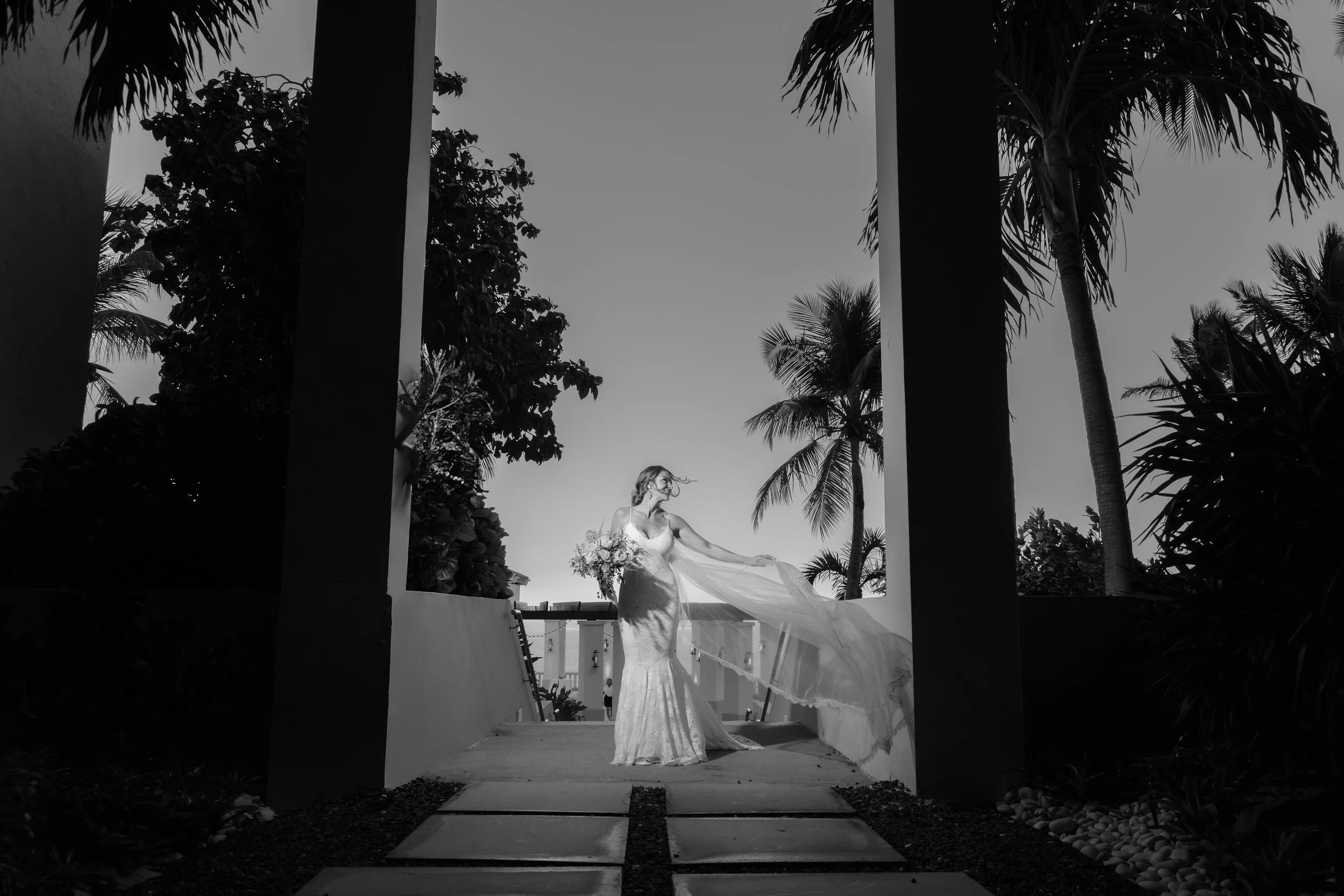 Bride playing with her dress at El Conquistador Resort taken by a luxury wedding photographer in Puerto Rico