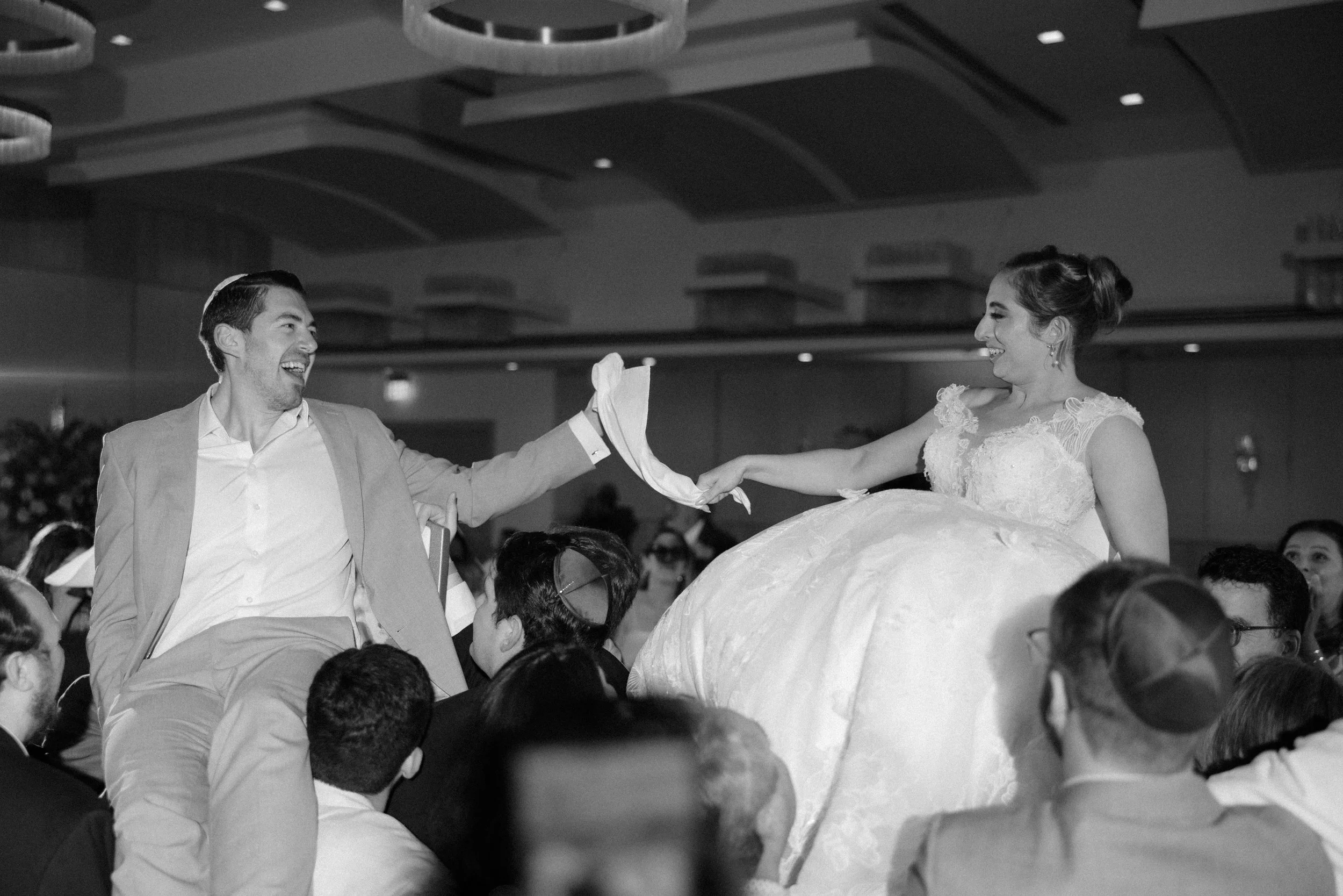 Jewish couple celebrating the Horah at La Concha Resort shot by an editorial wedding photographer in Puerto Rico
