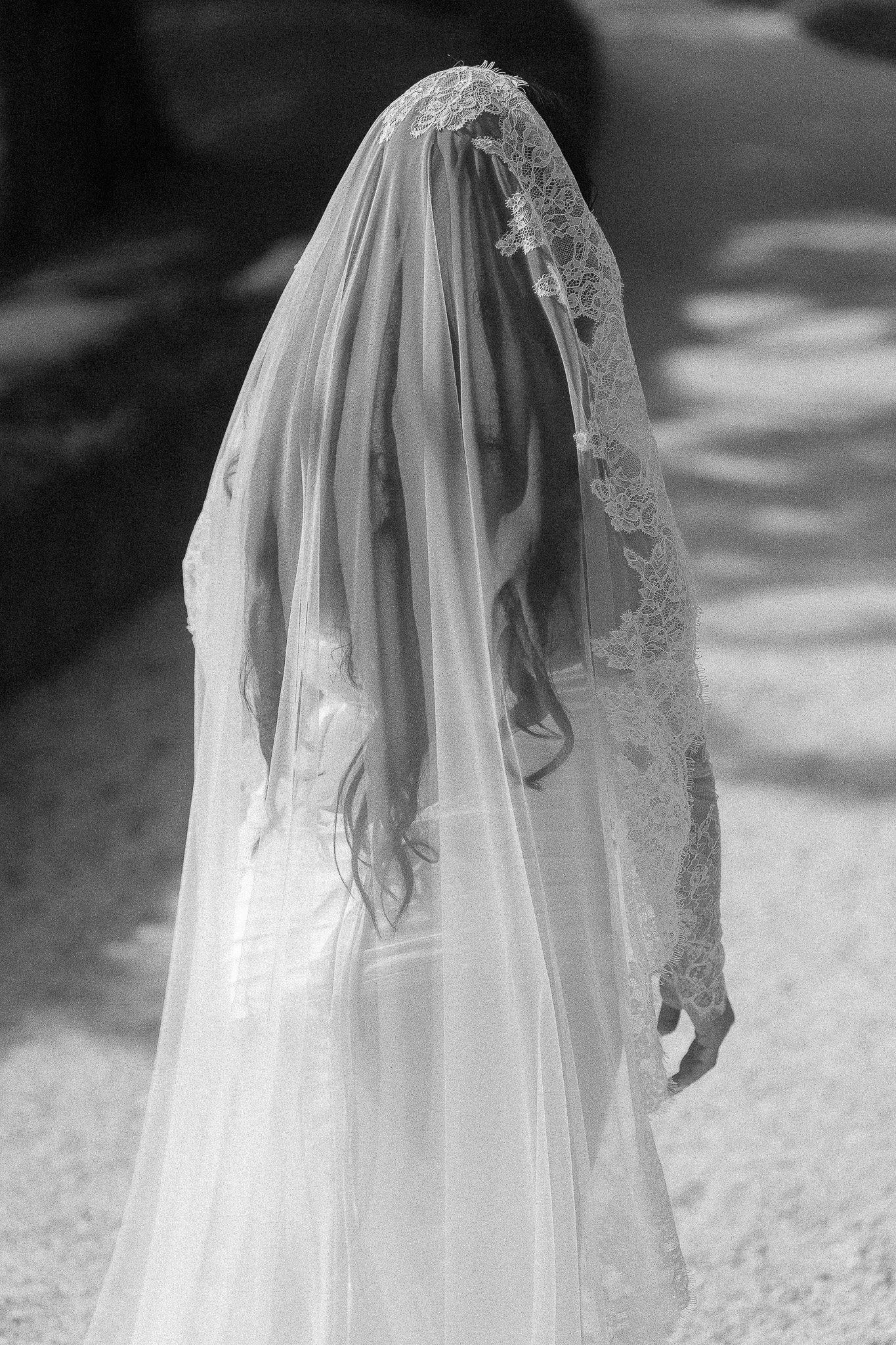 Editorial portrait of a bride in her wedding dress at Villa del Balbianello in Lake Como, Italy