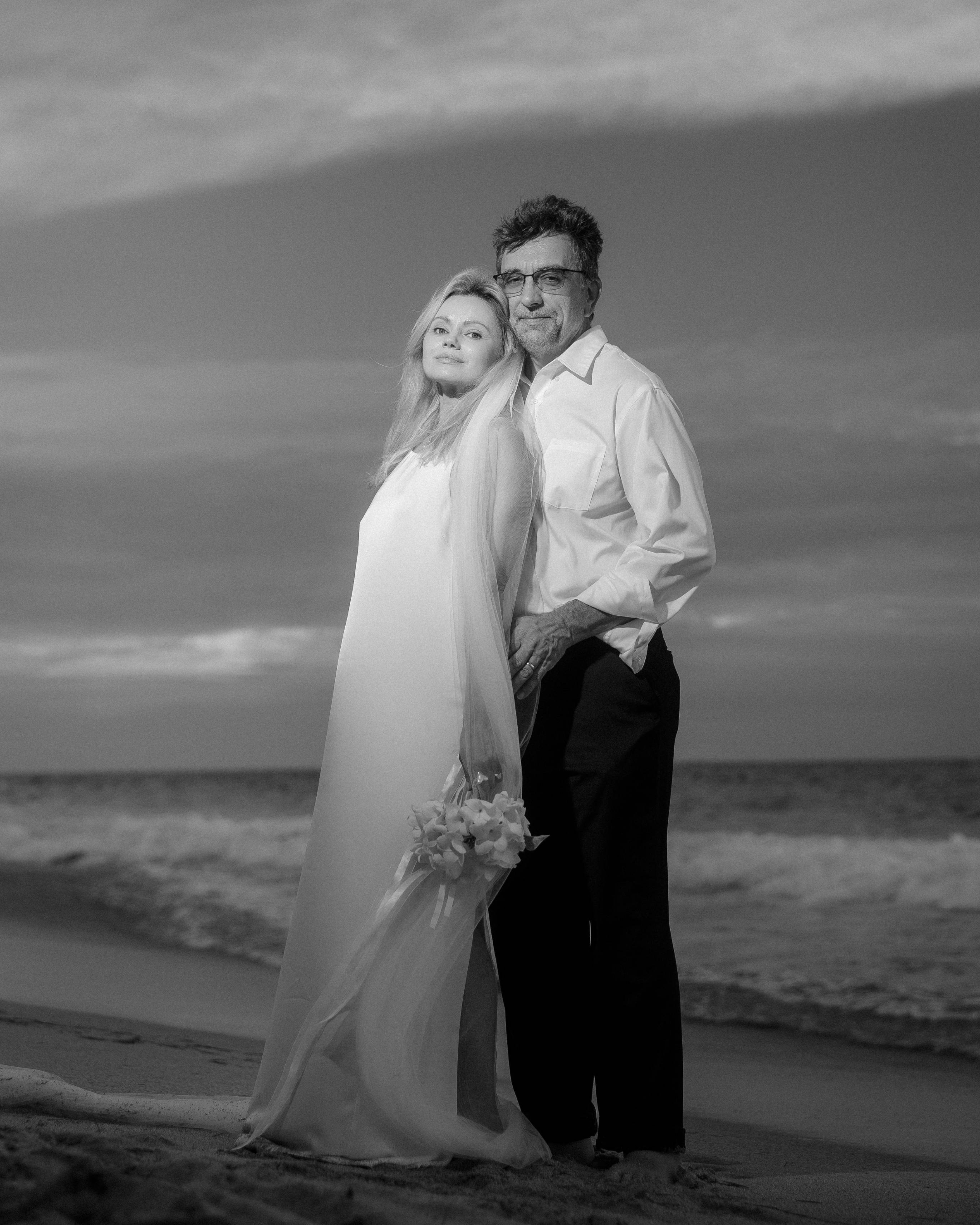 Couple posing for an elopement photographer in Puerto Rico at Condado Beach