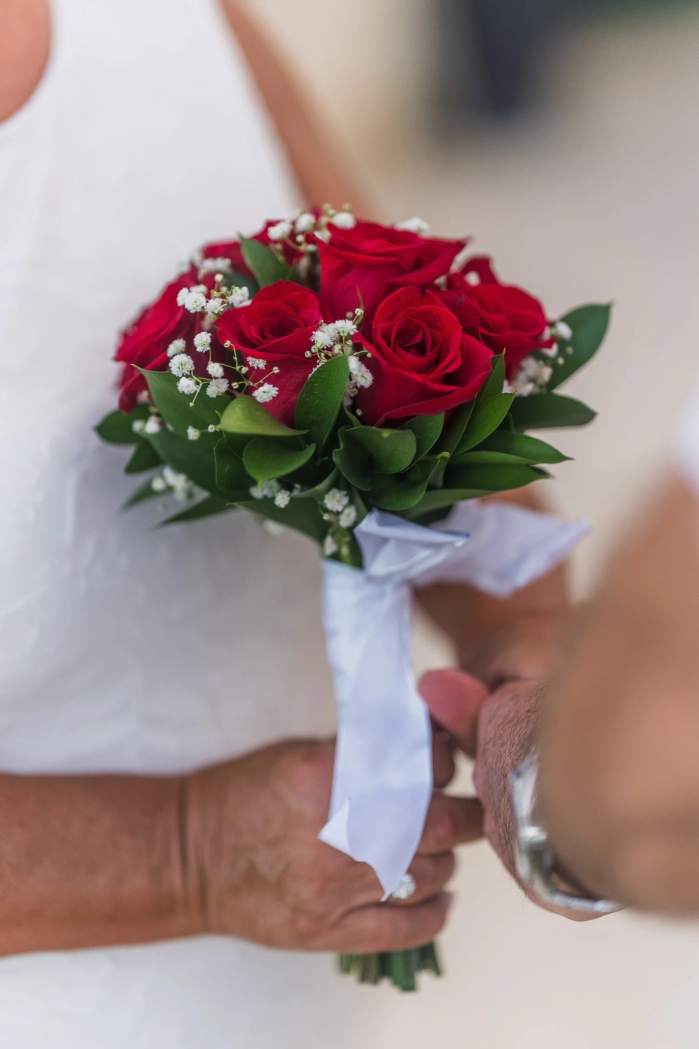 Luxury bouquet at the Condado Vanderbilt Hotel held by the bride during her elopement ceremony shot by a destination wedding photographer in Puerto Rico