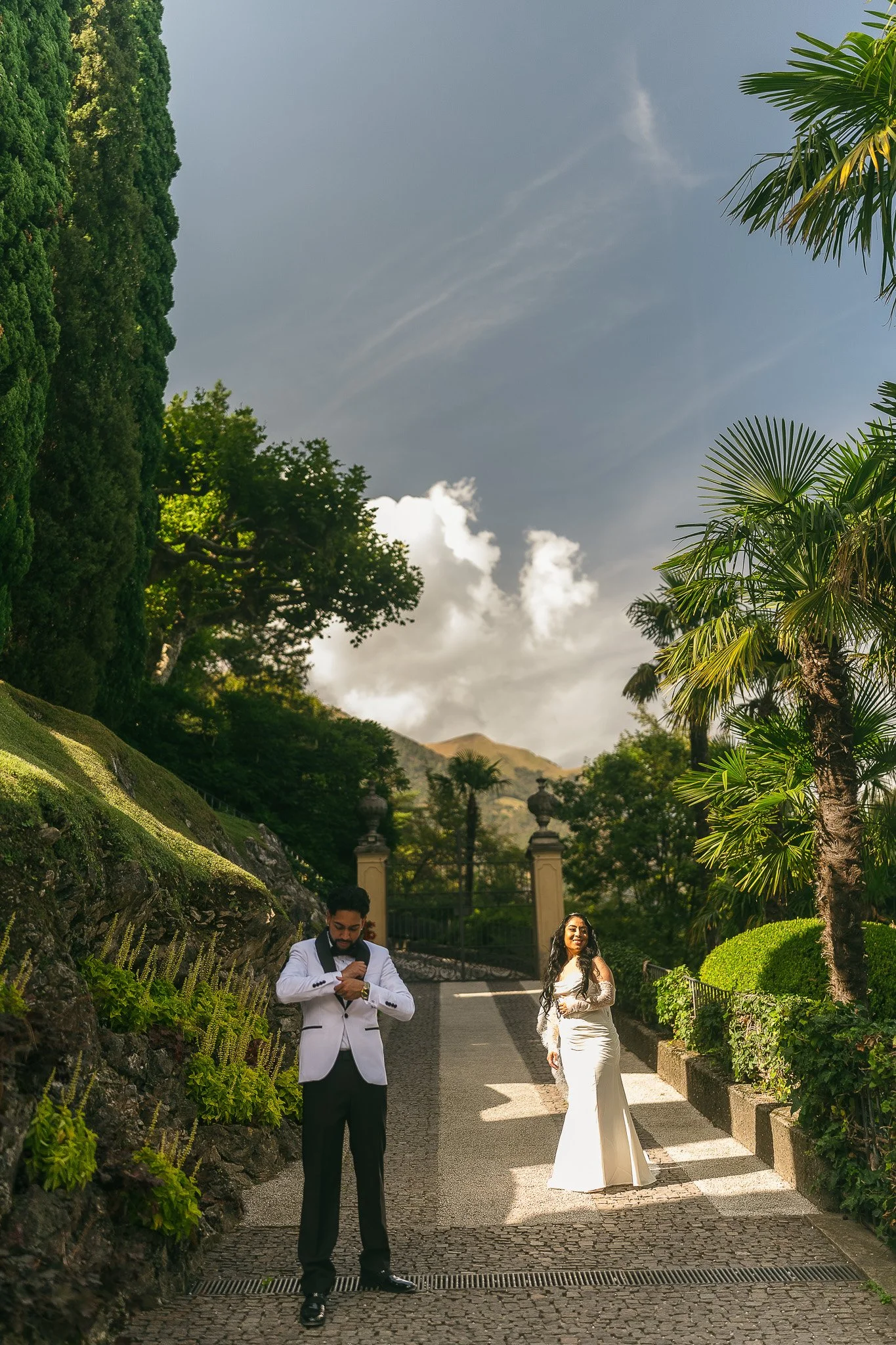 Bride and groom posing at Villa del Balbianello in Lake Como taken by a luxury wedding photographer in Italy