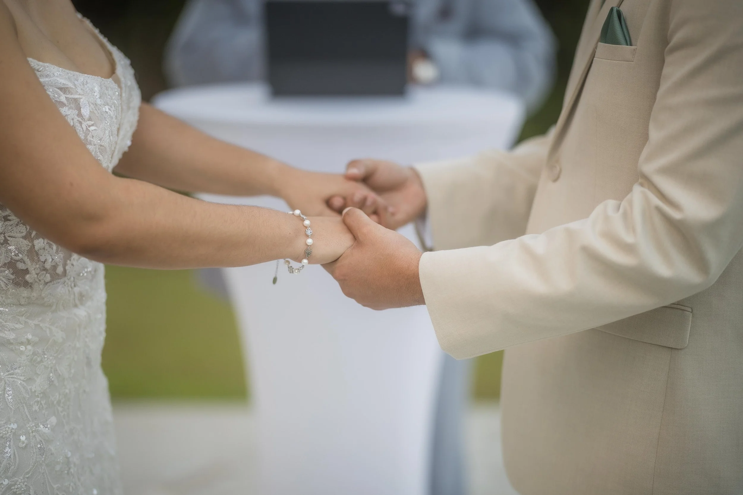 Couple holding hands during wedding ceremony at Hacienda Santiago, a wedding venue in Puerto Rico