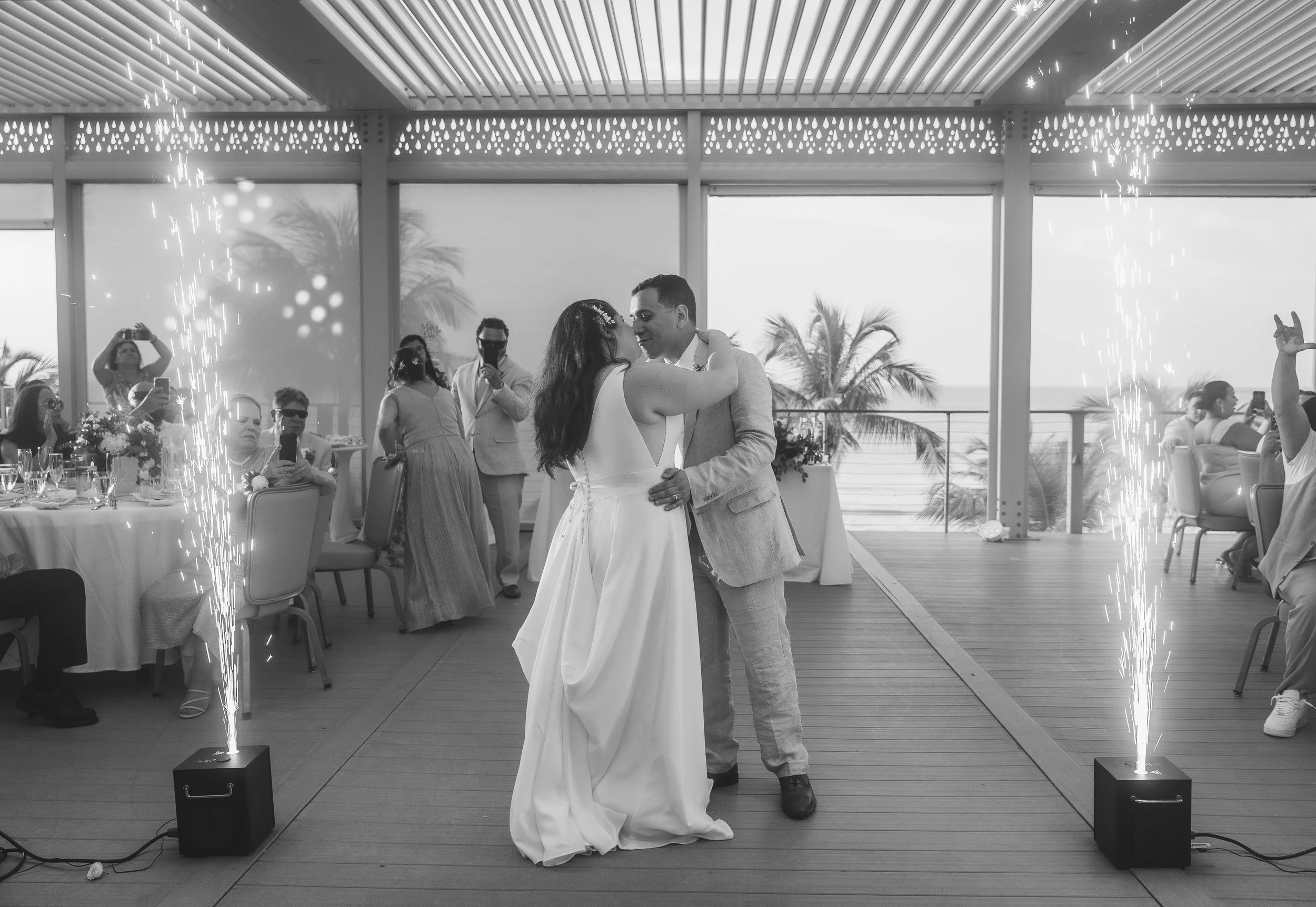 A couple dances at the Courtyard Marriott Isla Verde shot by a luxury wedding photographer in Puerto Rico.