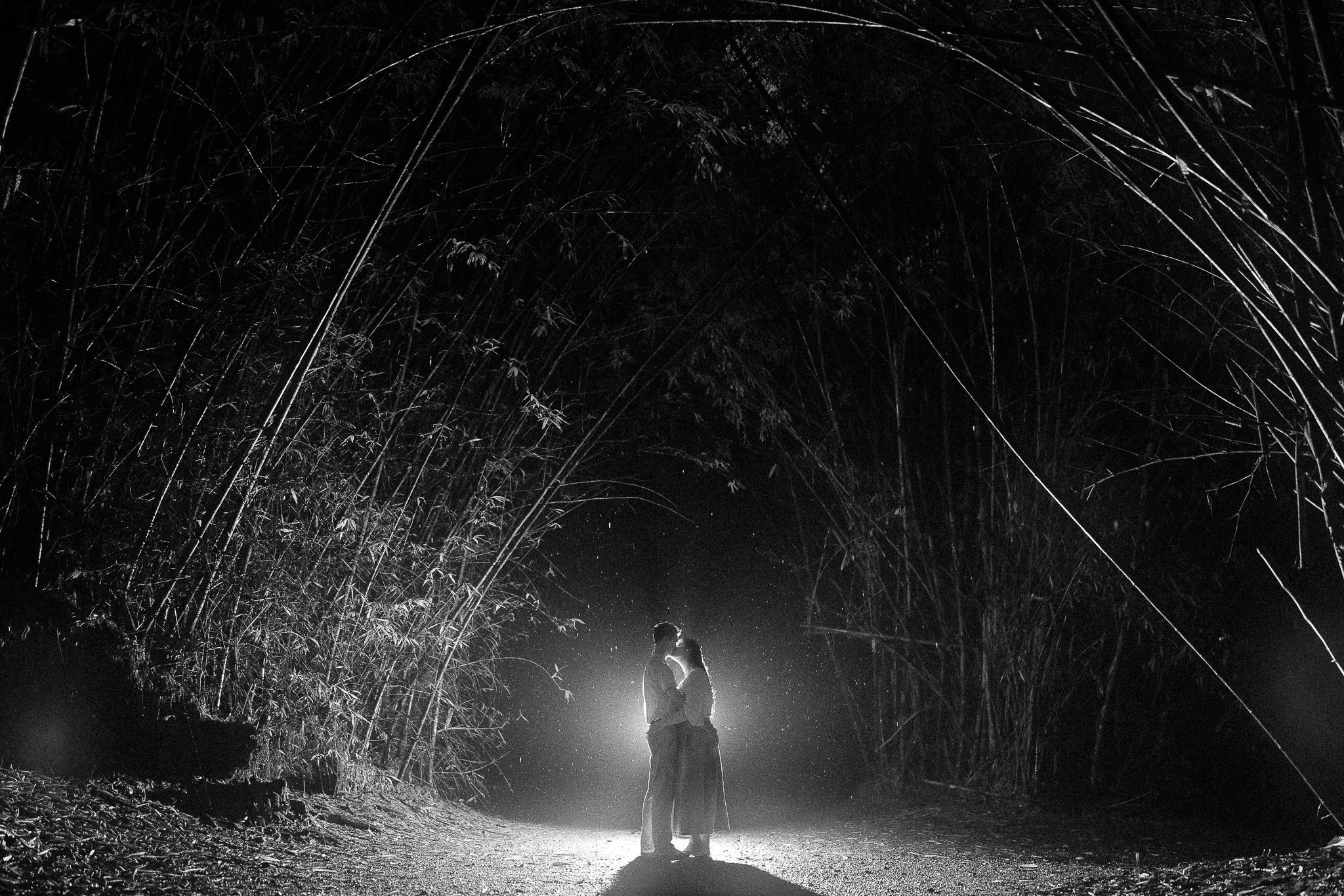 Black and white portrait of a couple kissing during their marriage proposal taken by a destination wedding photographer in Puerto Rico
