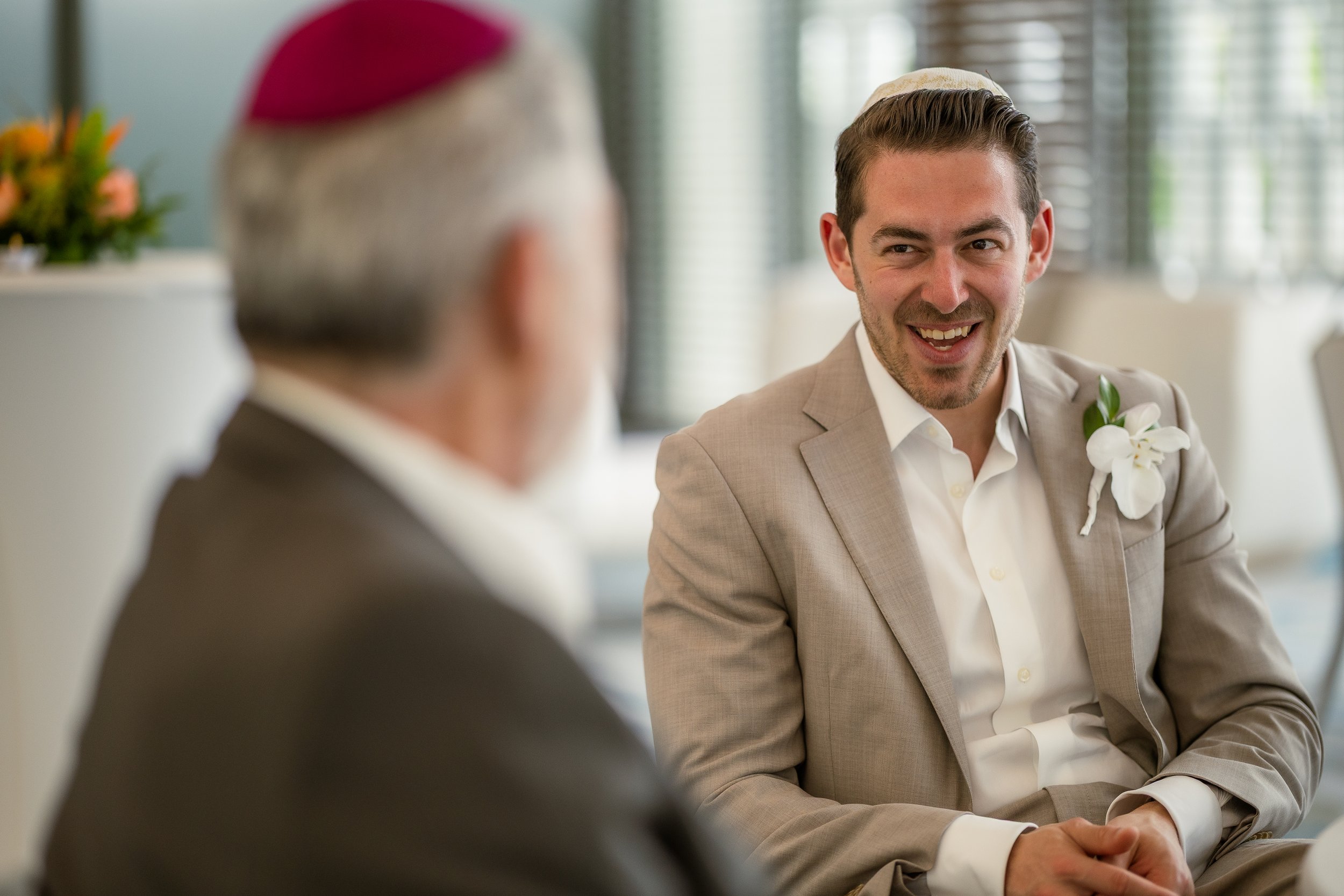 Groom signing the Ketubah during a Jewish wedding at La Concha Resort taken by a luxury wedding photographer in Puerto Rico