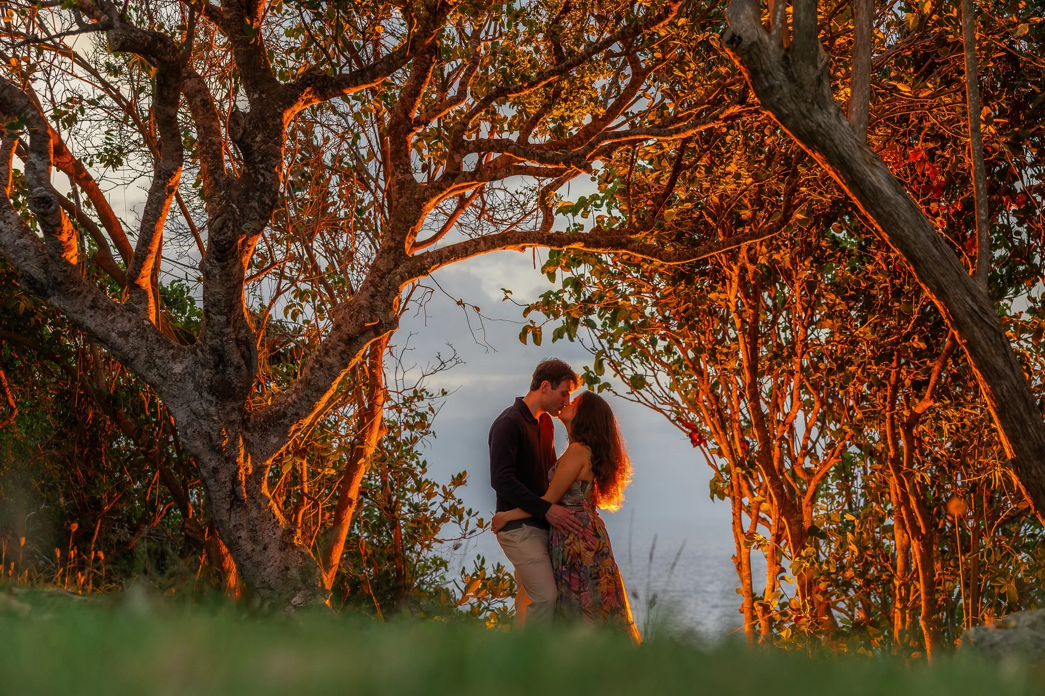 Golden Hour portrait of a couple during an engagement session in Puerto Rico at Royal Isabela taken by a destination wedding photographer