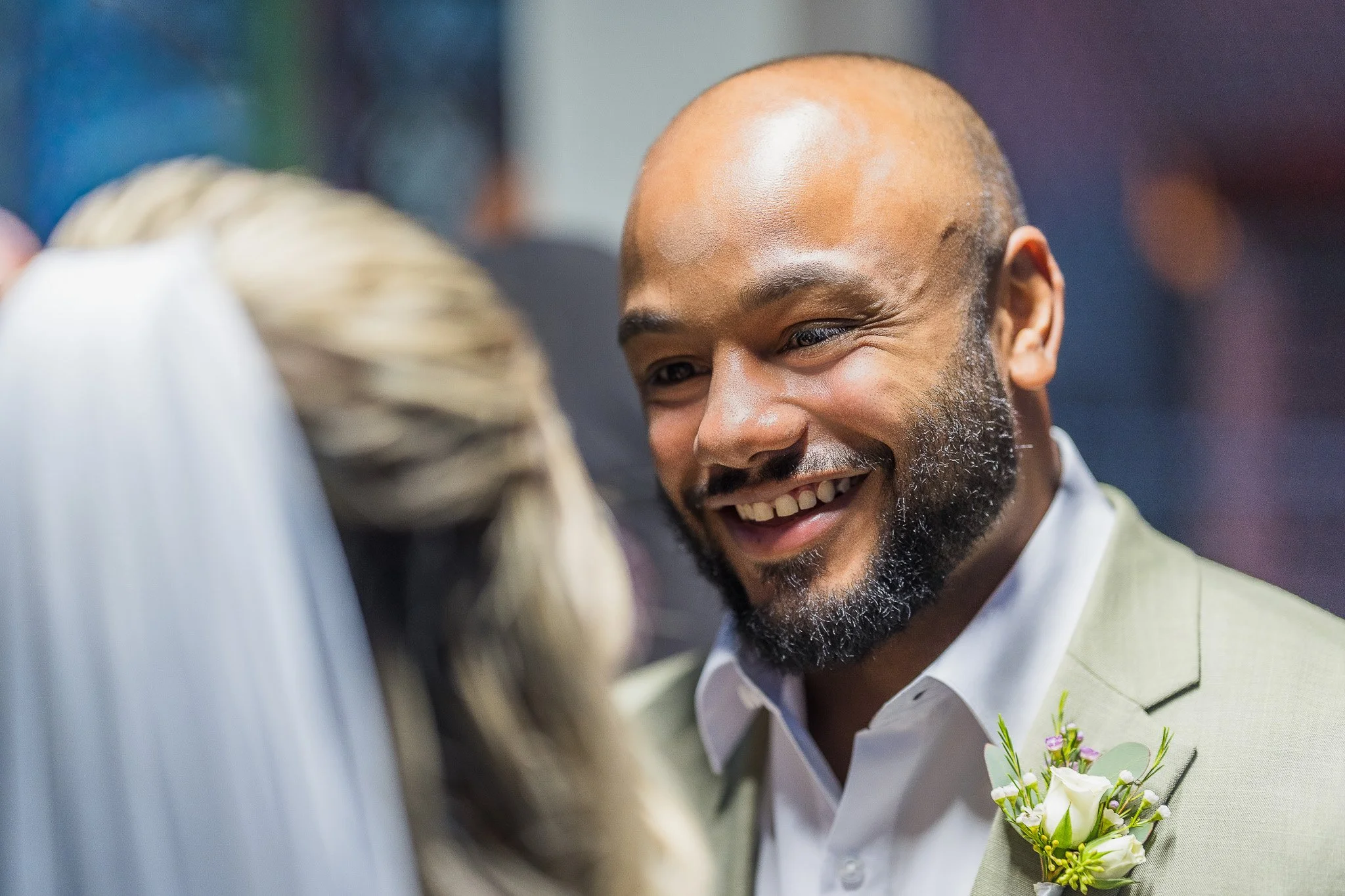 Groom smiling at bride during their ceremony taken by a Puerto Rico destination wedding photographer