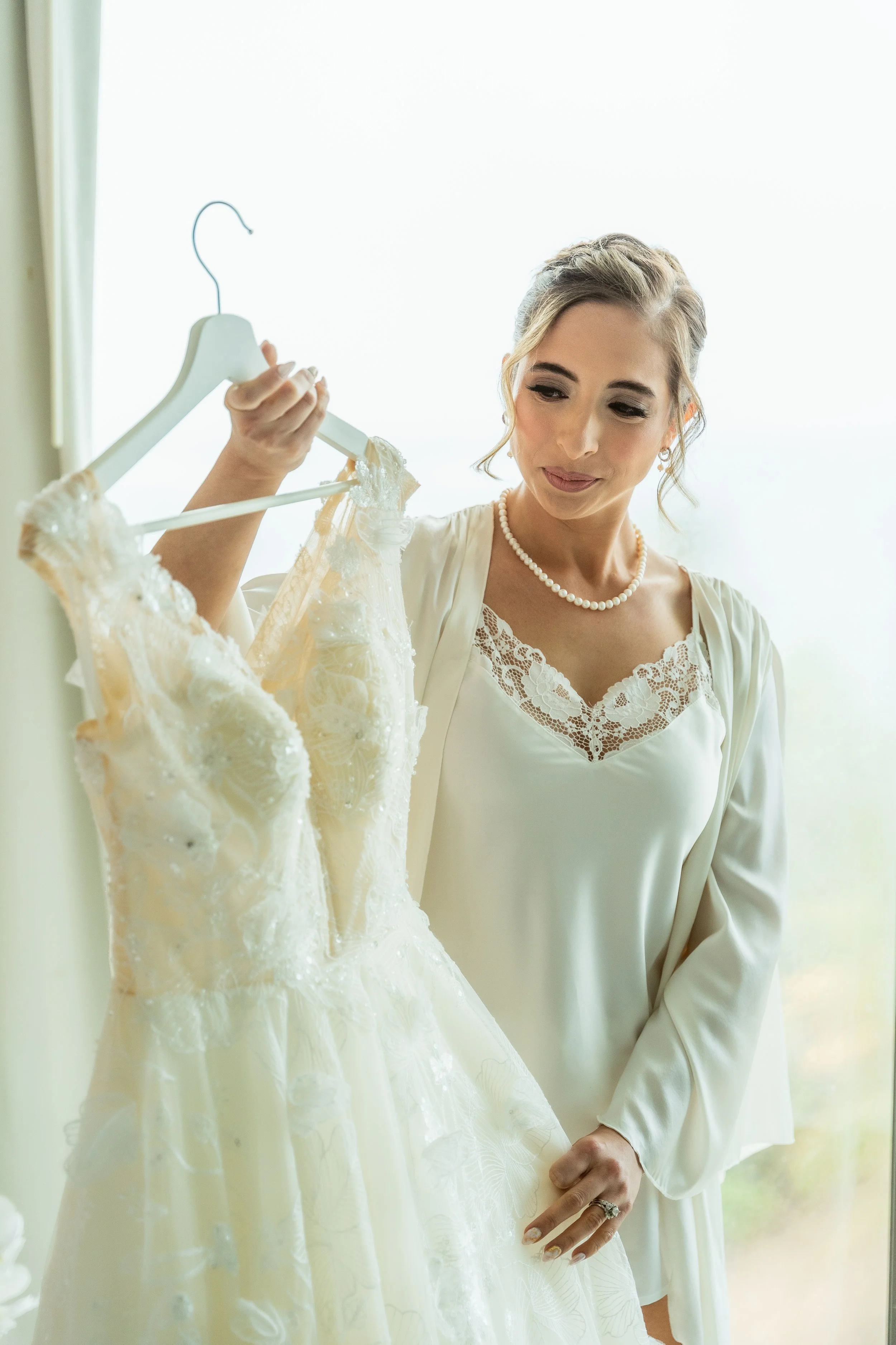 Bridal holding gown at La Concha Resort taken by a luxury photographer during a Jewish wedding in Puerto Rico