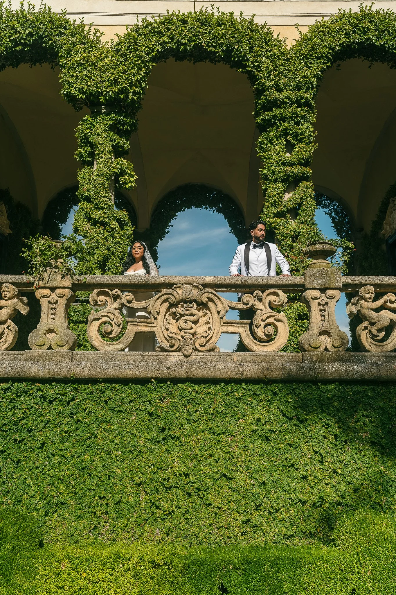 Bride overlooking Lake Como during their editorial elopement at the Villa del Balbianello shot by a wedding photographer in Italy