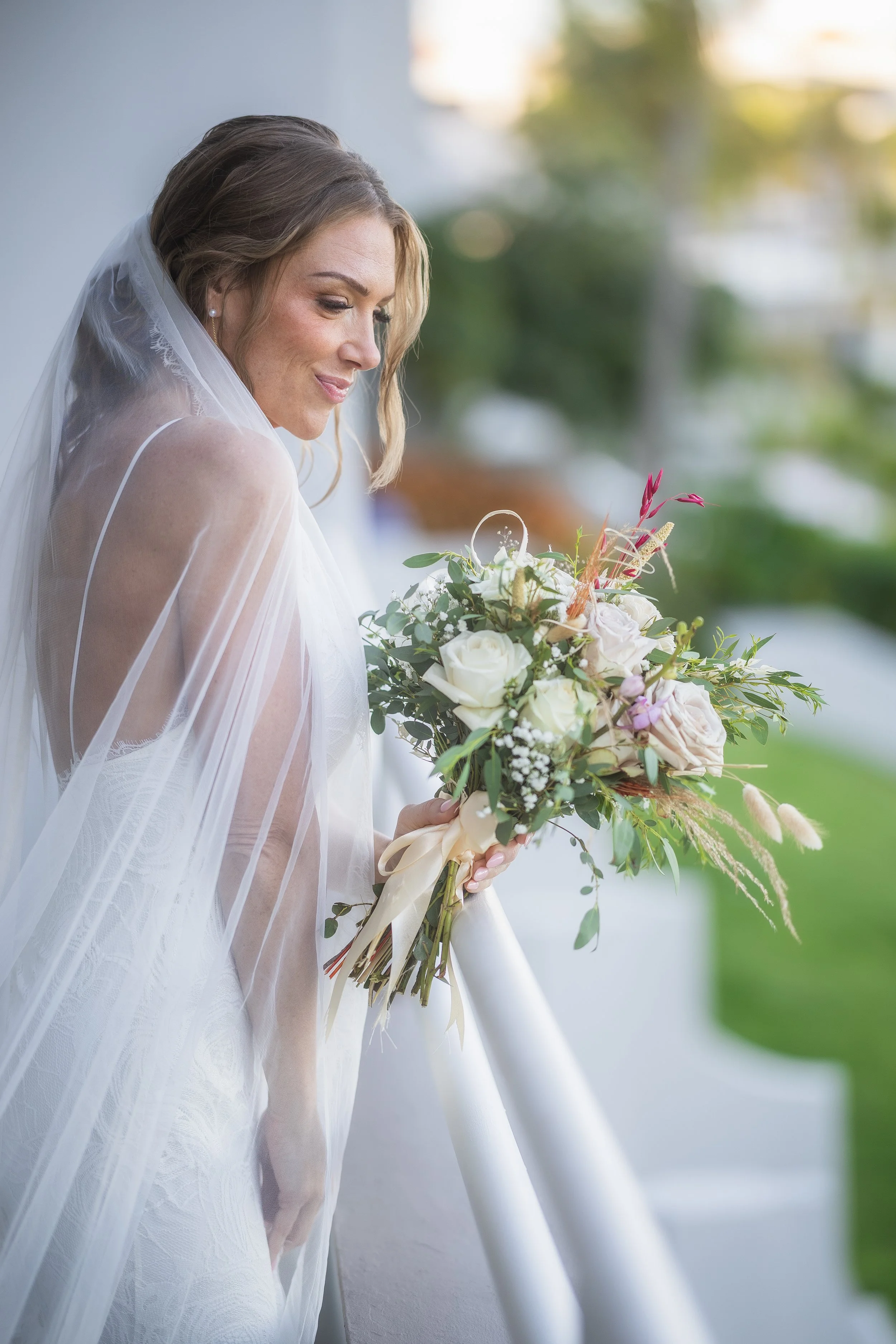 Bride wearing veil before her ceremony at El Conquistador Resort taken by a wedding photographer in Puerto Rico