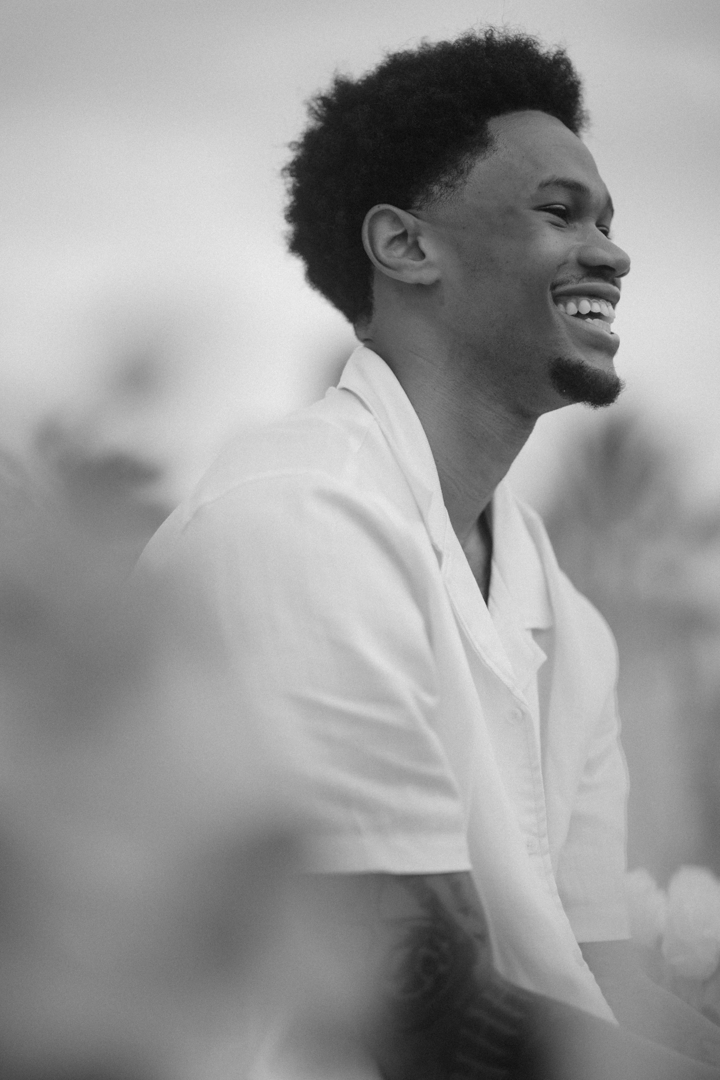 Editorial black and white portrait of a celebrity during an engagement session after a marriage proposal in Puerto Rico