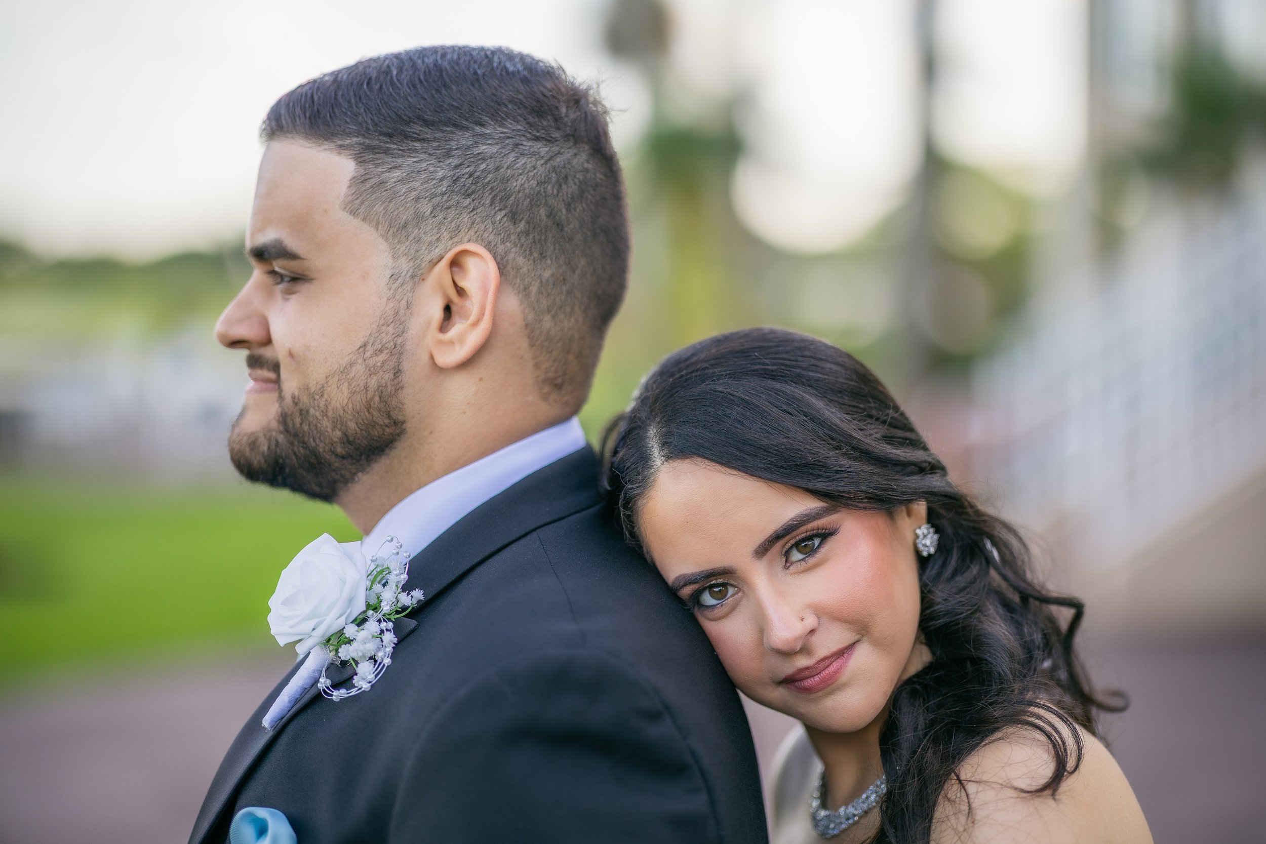 Bride and groom embracing after their luxury wedding ceremony at Indian Spring Country Club in Boynton Beach, Florida