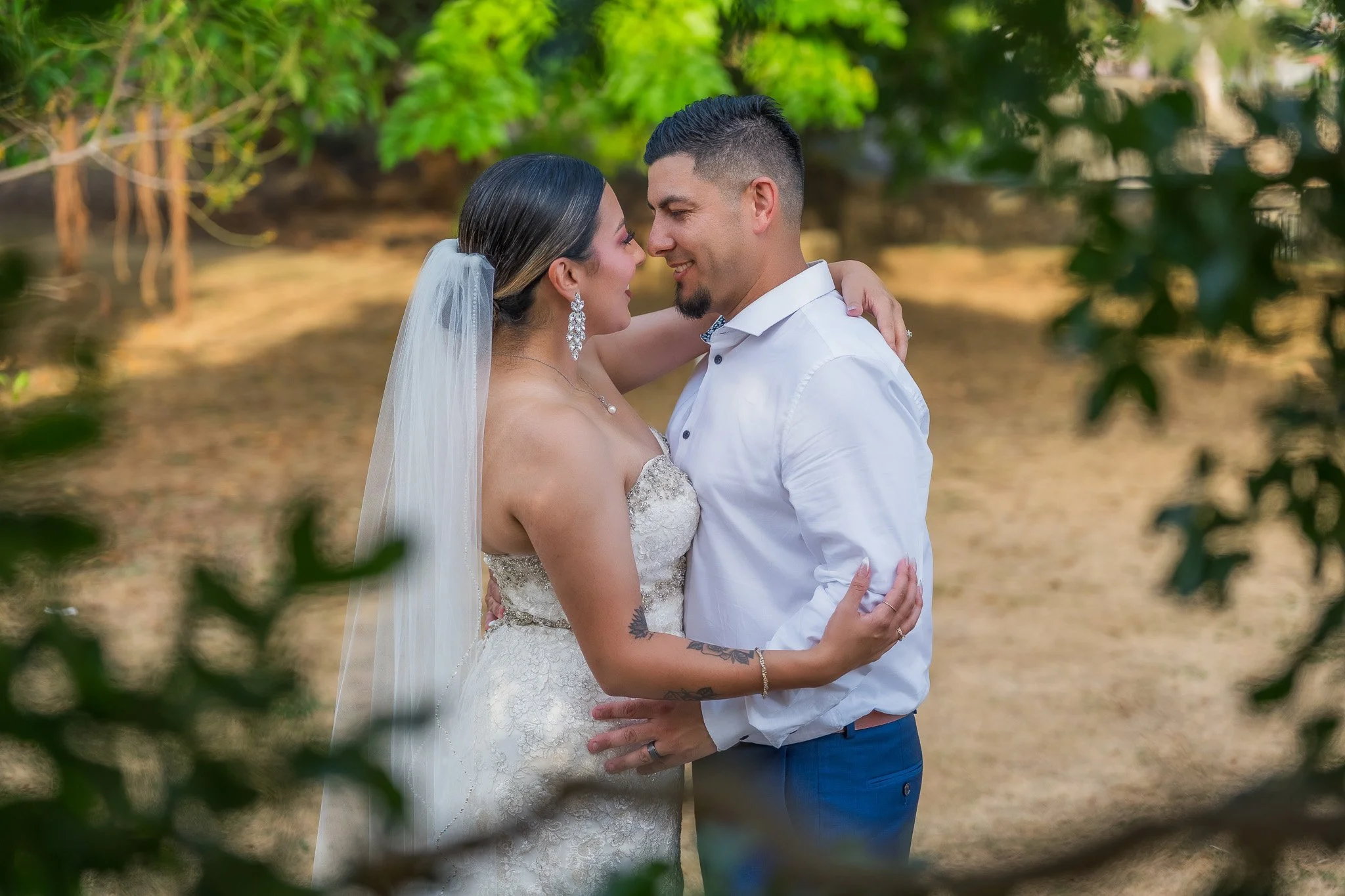 Bride and groom embracing through an artistic portrait in Old San Juan, Puerto Rico during their luxury elopement wedding ceremony.