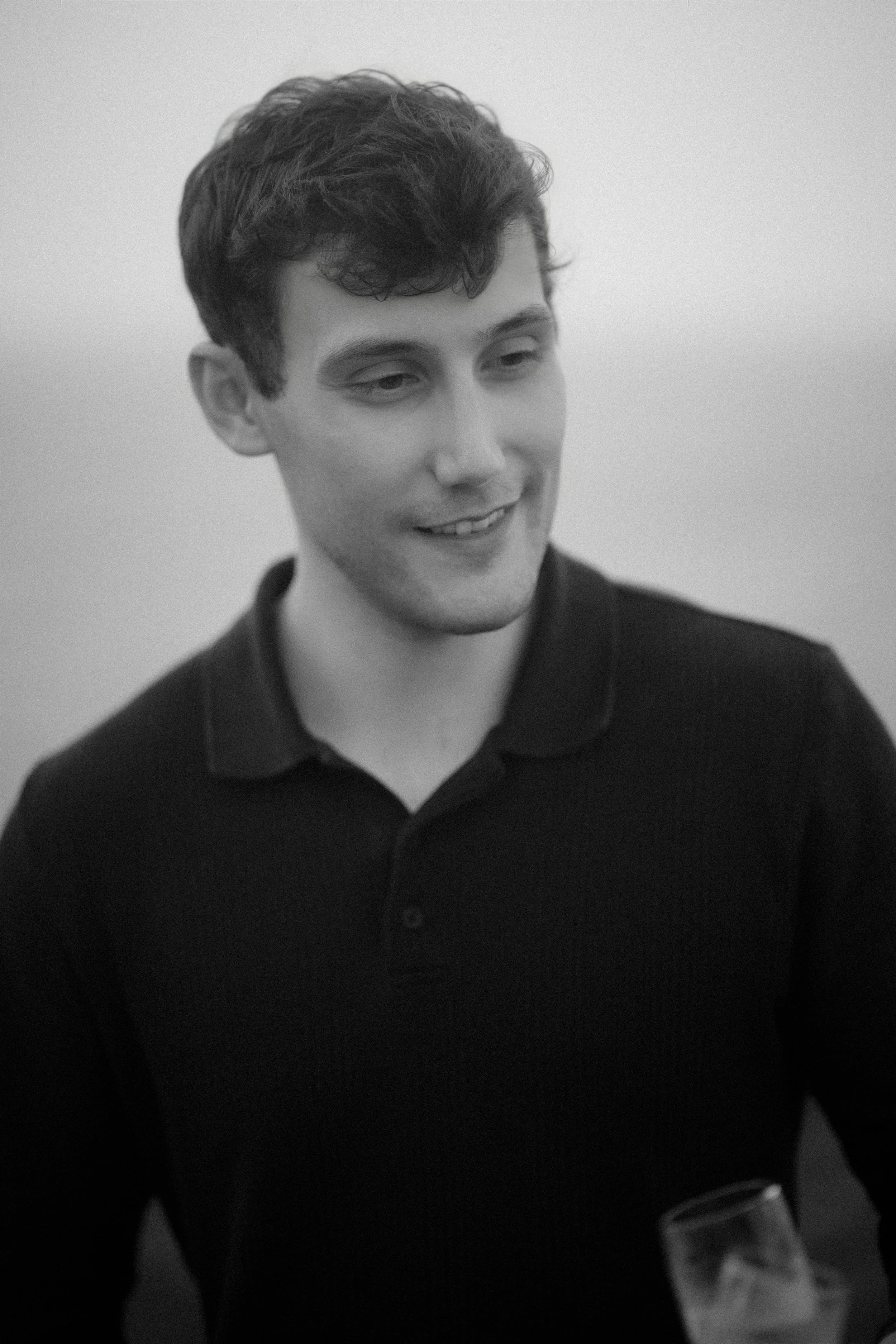 Black and white editorial portrait of a man at Royal Isabela after a surprise marriage proposal taken by a luxury wedding photographer in Puerto Rico
